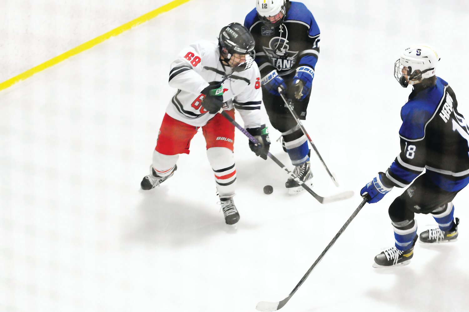 CB East’s leading scorer Corey Kosick, left, is defended by Peter Herring (No. 18) for CB South.