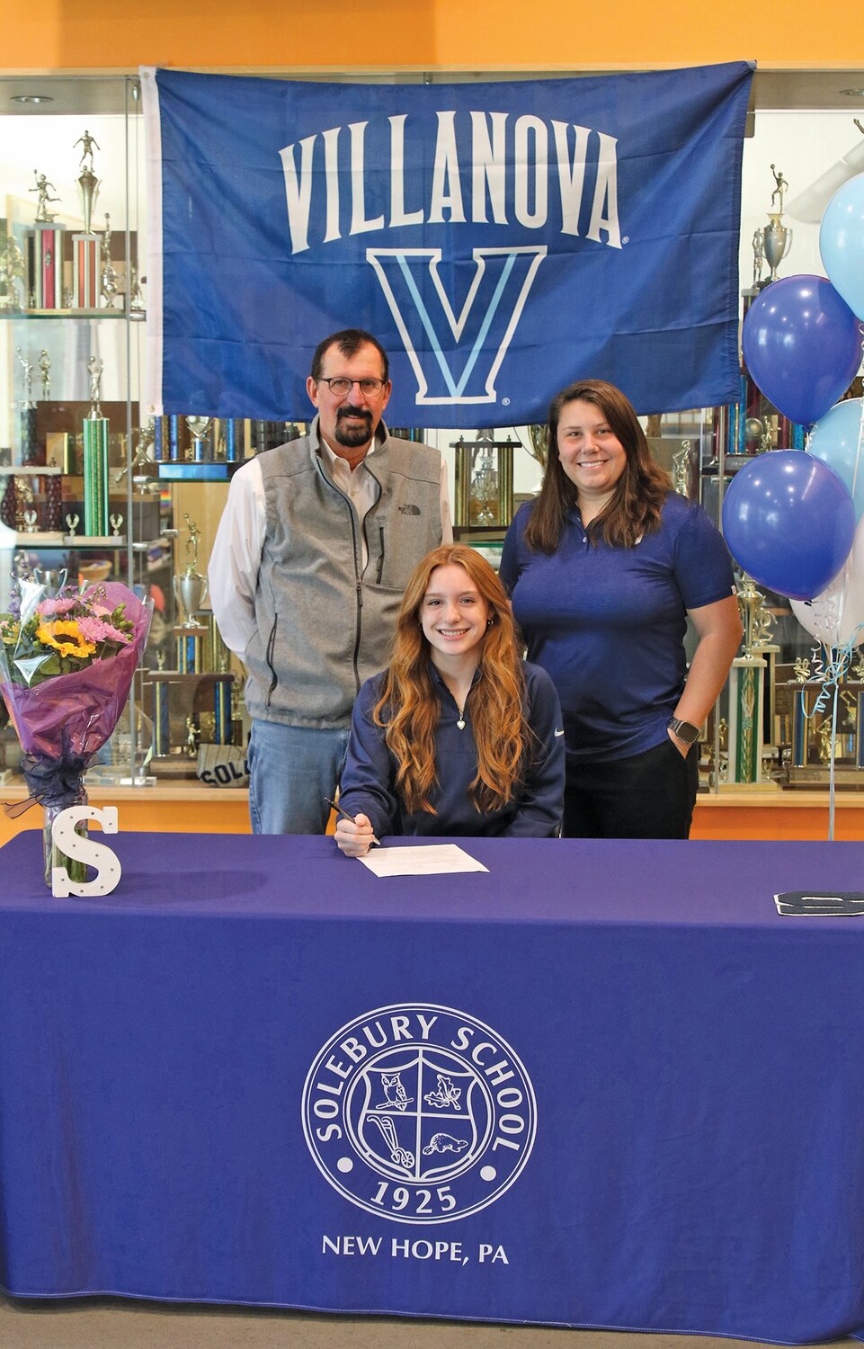 Villanova commit Kate Shipley with Tom Wilschutz, head of school, and Stacie Anastacio, director of athletics, Solebury School.