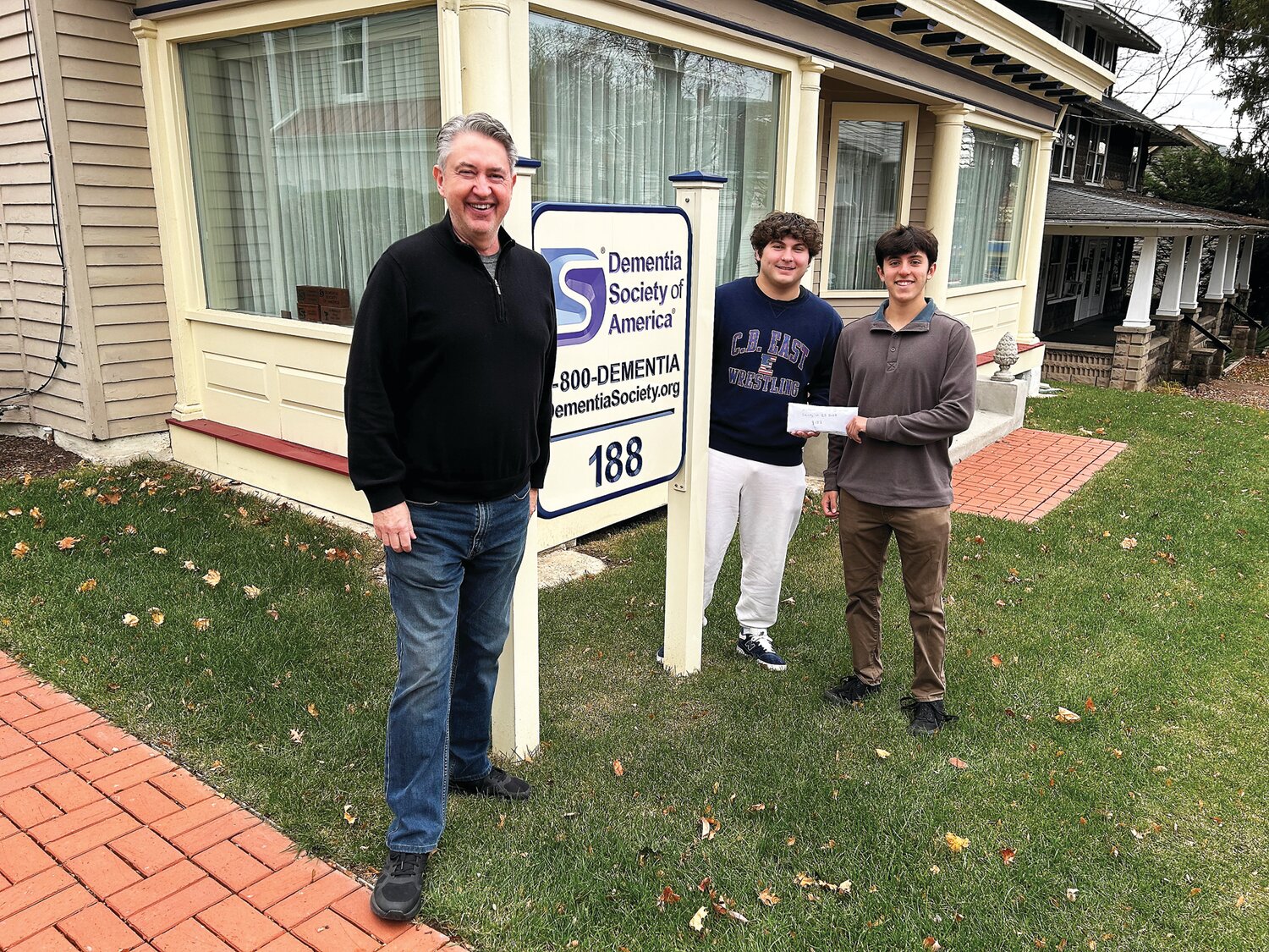 The Dementia Society of America works to raise awareness about the progressive syndrome. From left, Kevin Jameson, founder of the DSA, stands with Louis Daniels and Brandon Gaona, co-presidents of the Alzheimers and Dementia Society of Central Bucks East High School, which raises money for the organization.