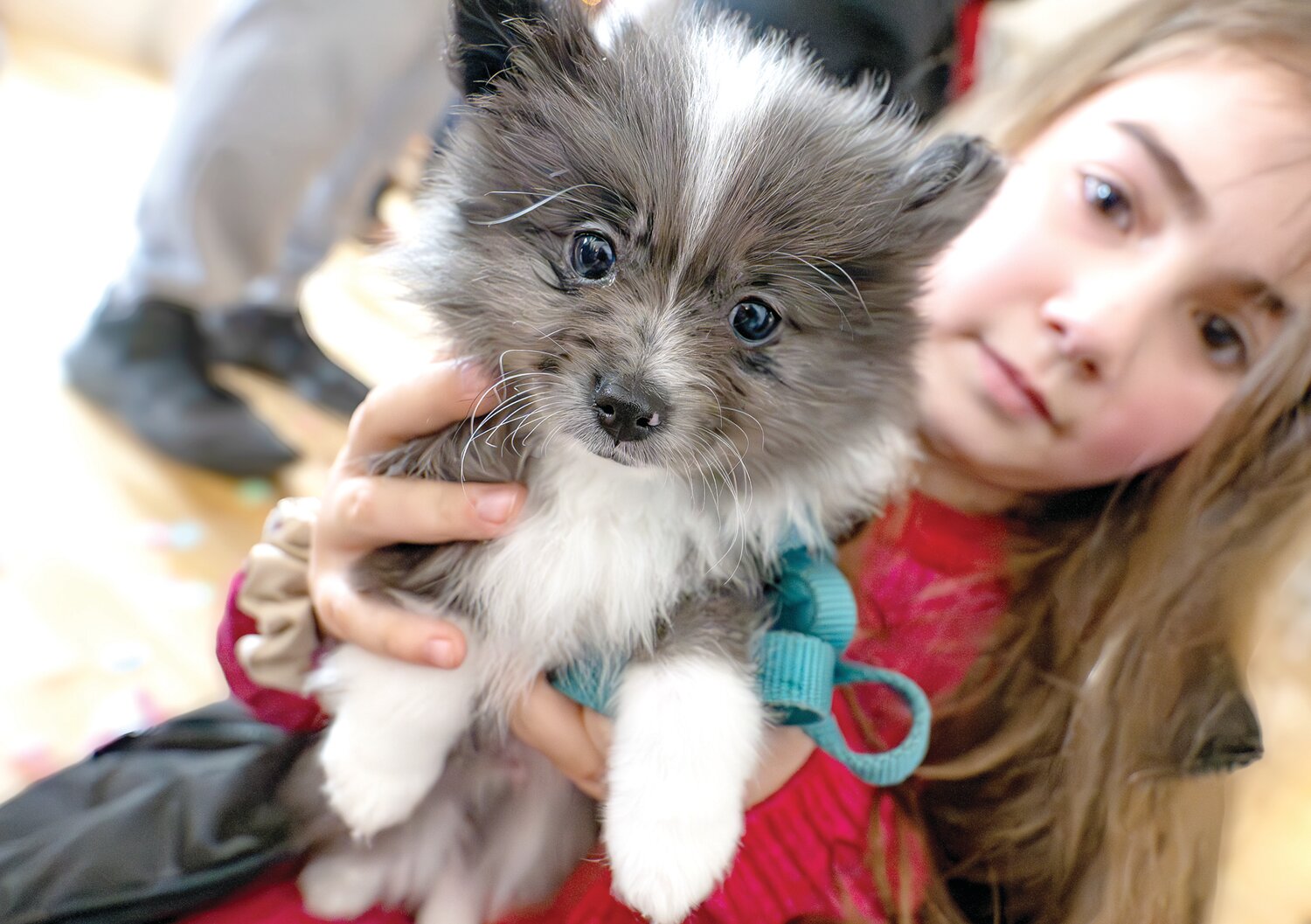 Zoey Hangey shows off her pup.