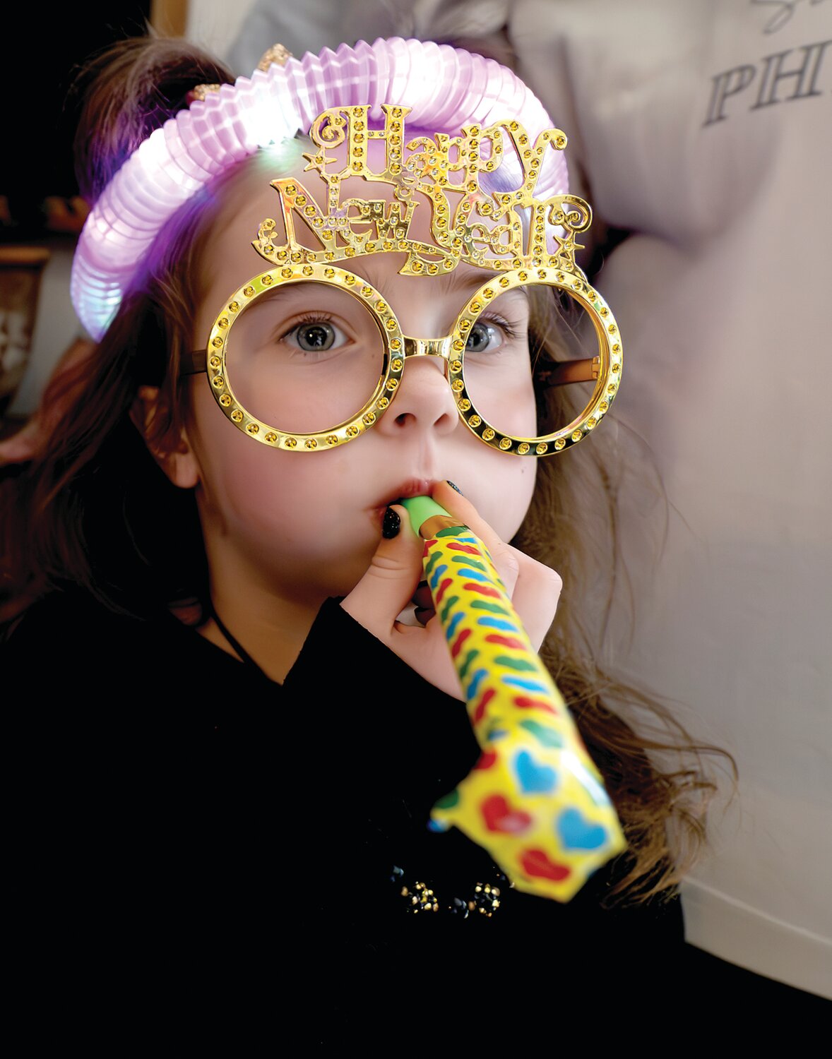 Lily Hanlon shows off her new specs and colorful headband.