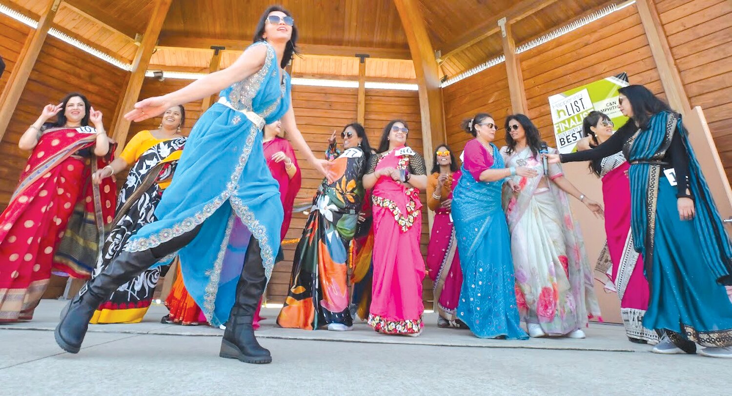 A woman dances at the Saree Run, held in Central Park in Doylestown on March 26. The run celebrated International Women’s Day and Women’s History Month and raised money for two nonprofit educational programs.