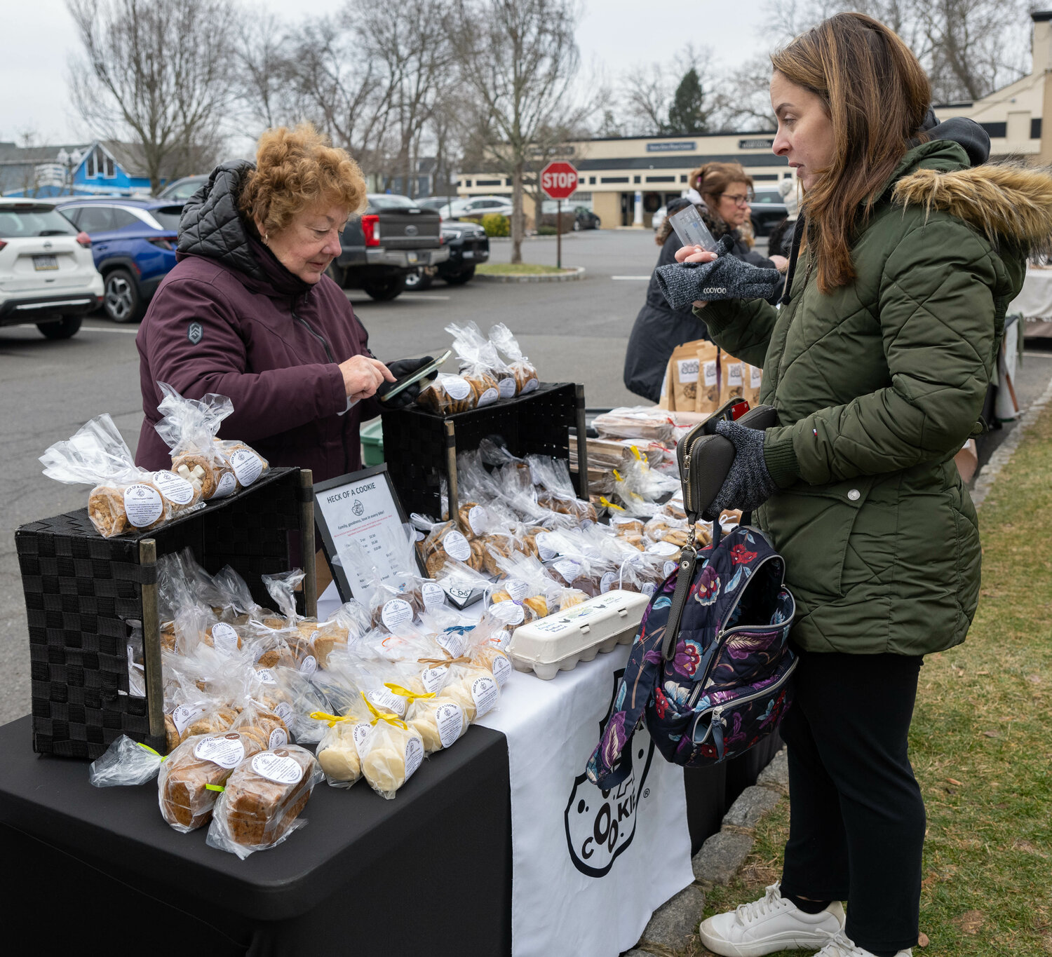 Gail Heck, of Heck of a Cookie, makes a sale.