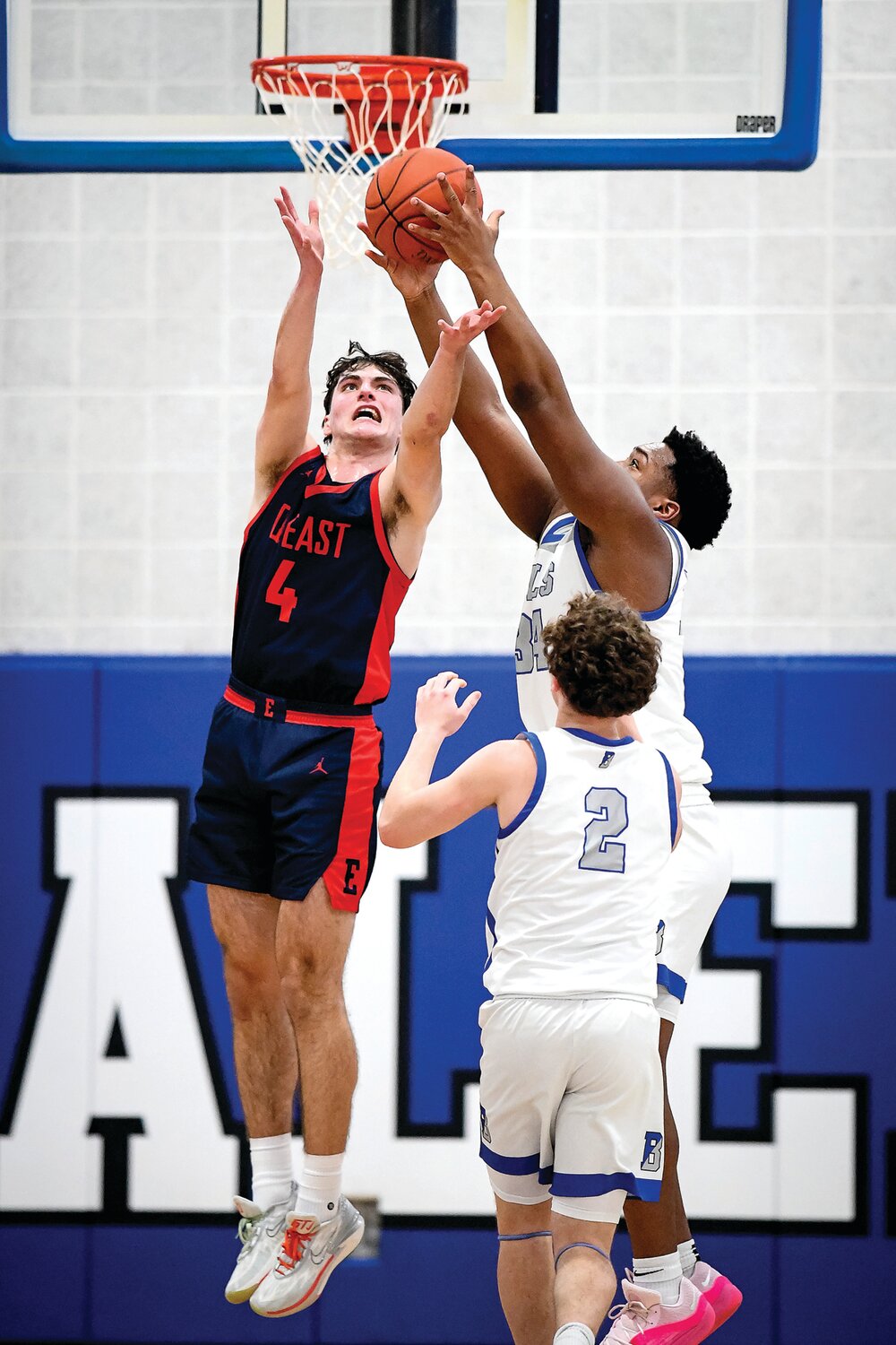 Central Bucks East’s Tyler Dandrea and Bensalem’s Jaidyn Moffitt battle for a loose ball.