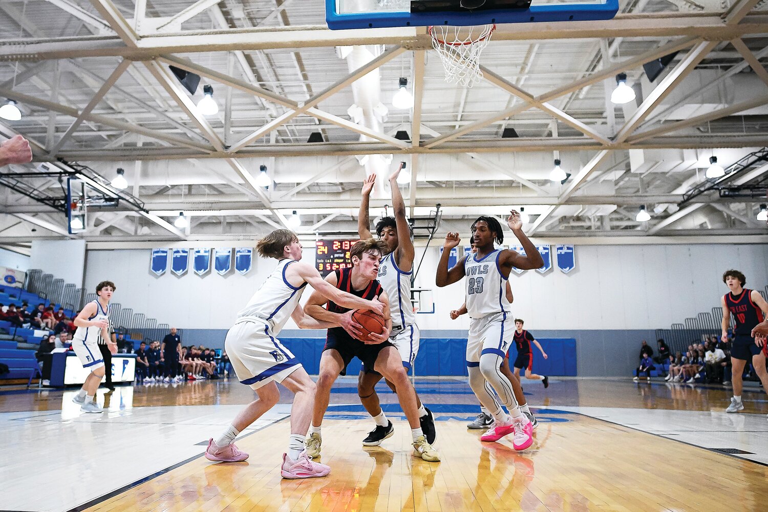 Central Bucks East’s Jacob Cummiskey gets surrounded while fighting for an offensive rebound.