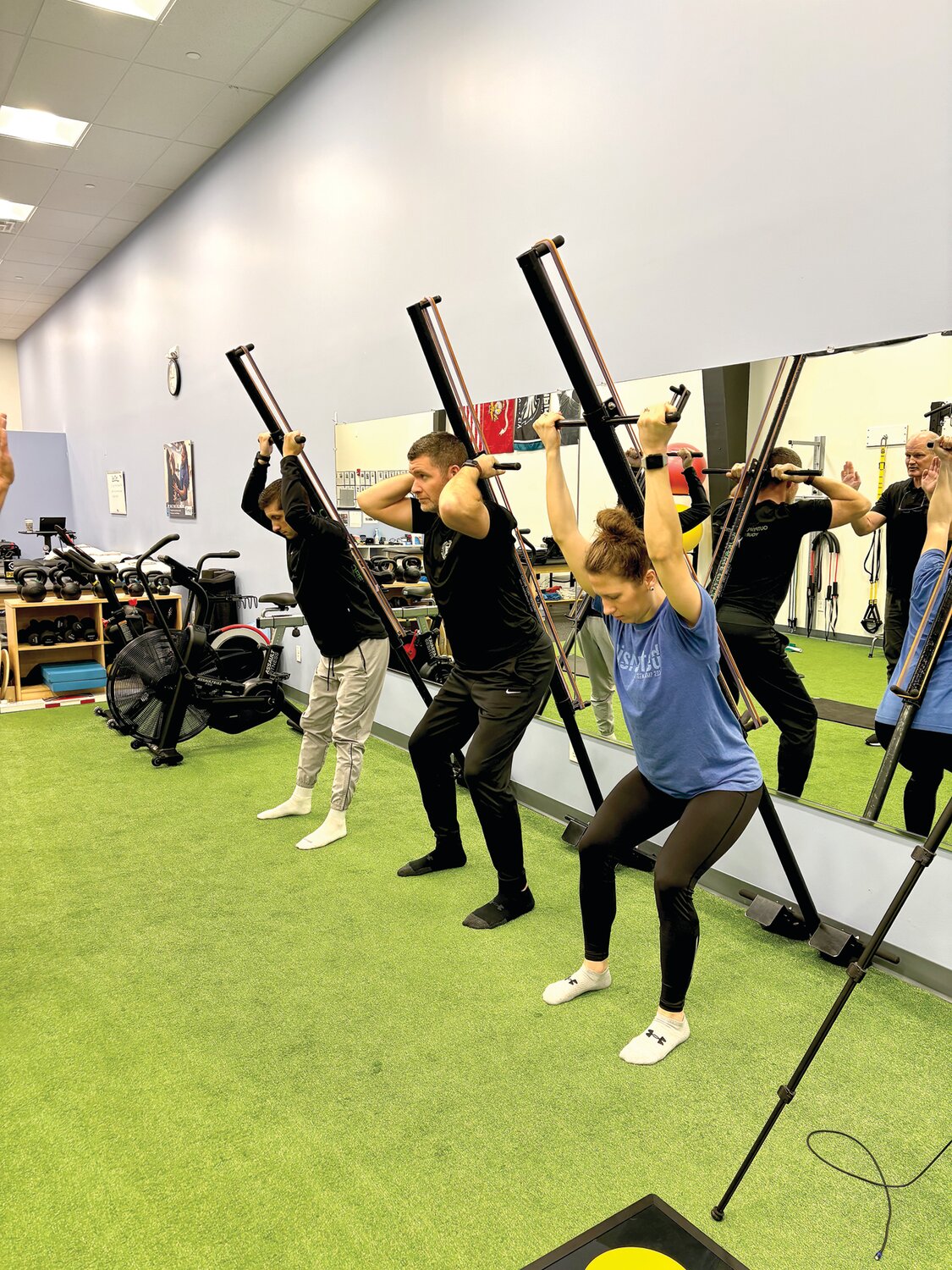 From left: Tyler Cunningham, Joe Ware and Kelly Nelson work out in a Level 1 Kaehler Core/Column Core certification class.