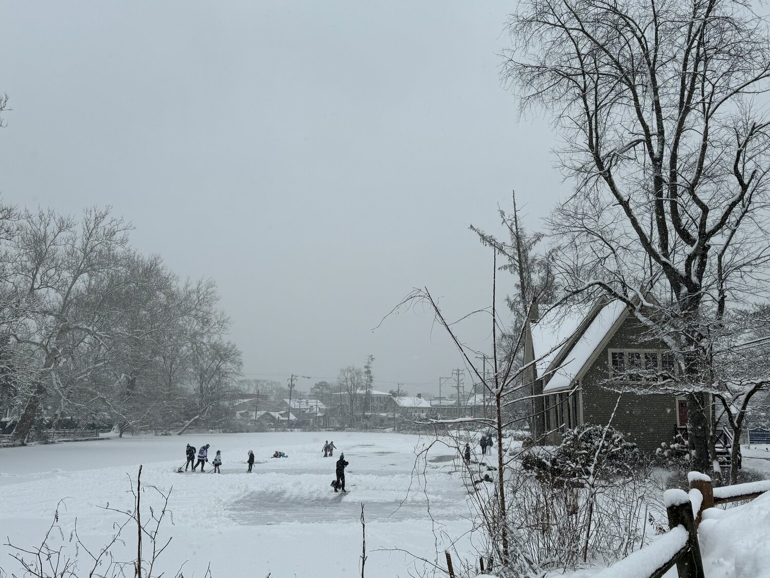 Frozen-over Lake Afton, in Yardley, became a makeshift ice hockey rink Friday as local children laced up their skates and enjoyed an unexpected day off from school.