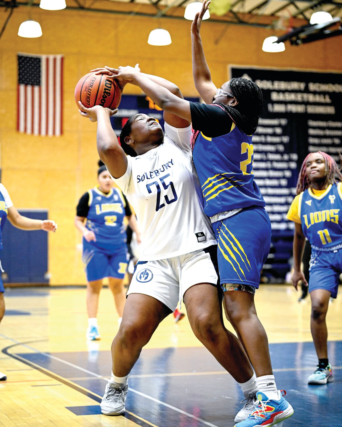 Solebury School’s Autumn Turner runs into the defense of The City School’s Maiya Porter.