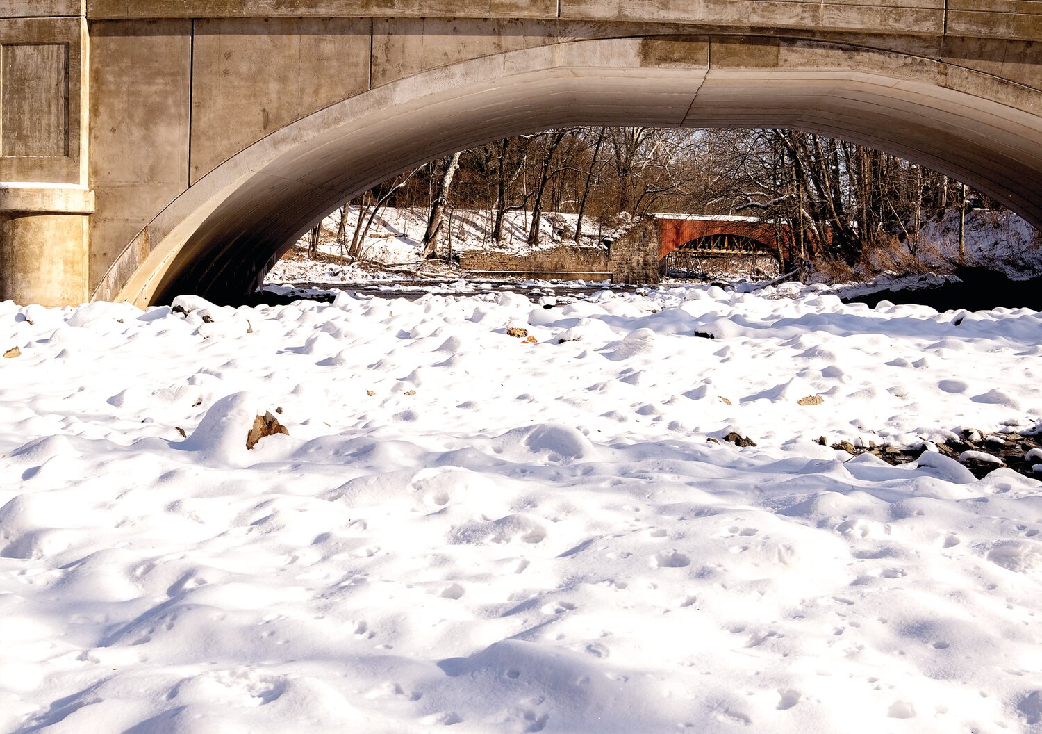 Snow lines the banks of the Tohickon Creek in Point Pleasant.