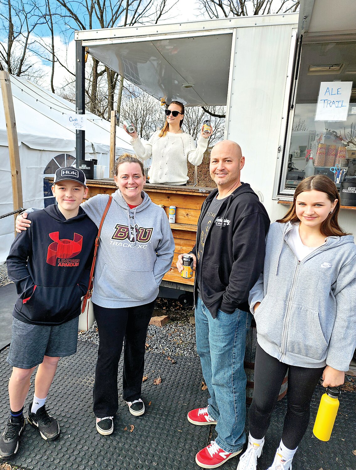 At the Rams beer garden are bartender Deb Coffee and Hunter Robinson, Krista Hollenbach and Brad, and Giada Arcade.