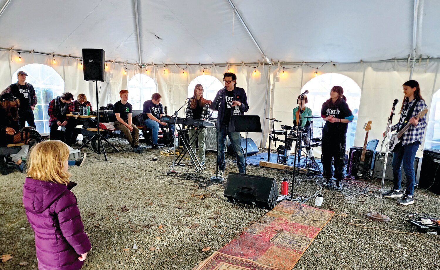 Underground Eclipse, a Pennridge High School student band, plays outdoors next to the Rams beer garden.