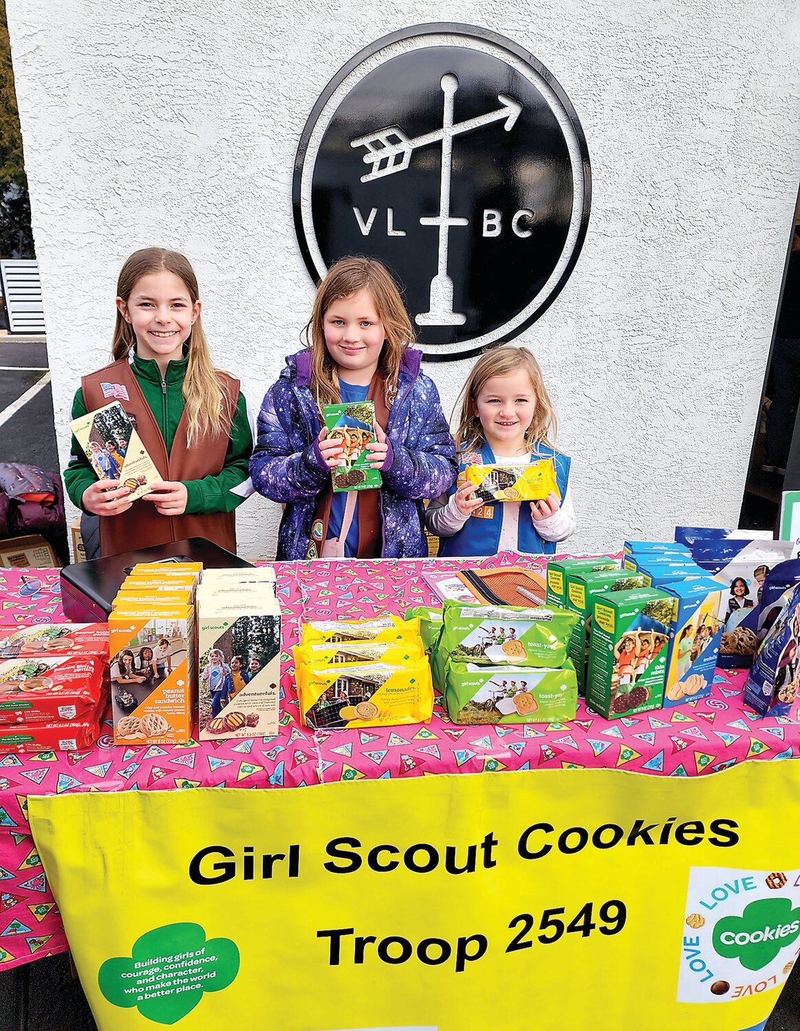 Girl Scouts Margaret Rees with sisters Rosa and Vicki sell cookies outside Van Lieus Brewing Co.