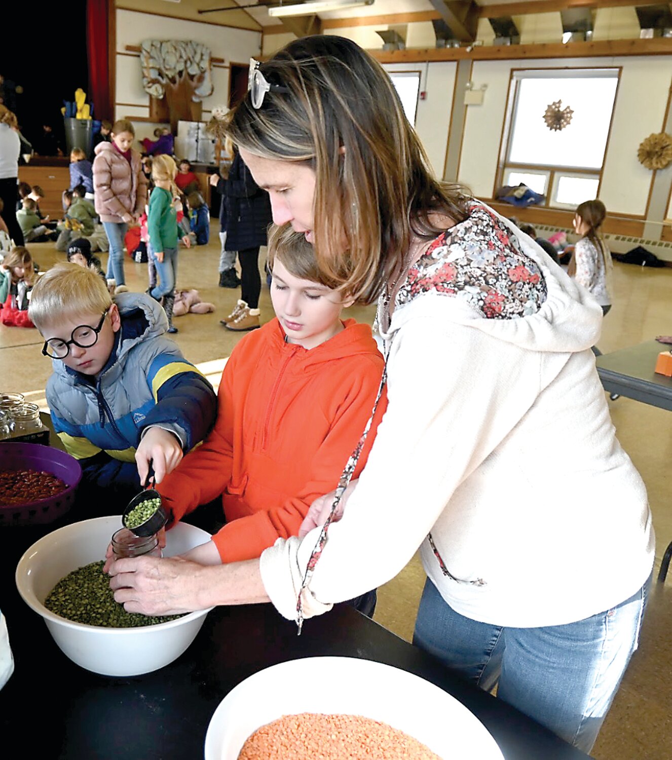 Members of the Buckingham Friends School community make dry soup jars that were donated to Fisherman’s Mark Pantry in Lambertville, N.J.