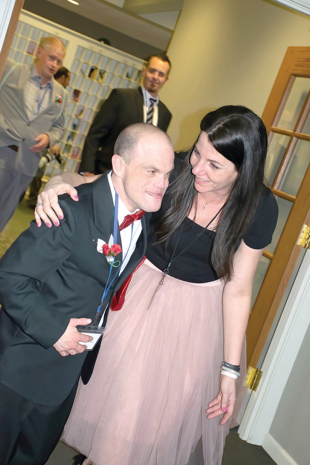 Smiles abound as people enter Night to Shine at Immanuel Leidy’s Church in Souderton on Feb. 9.