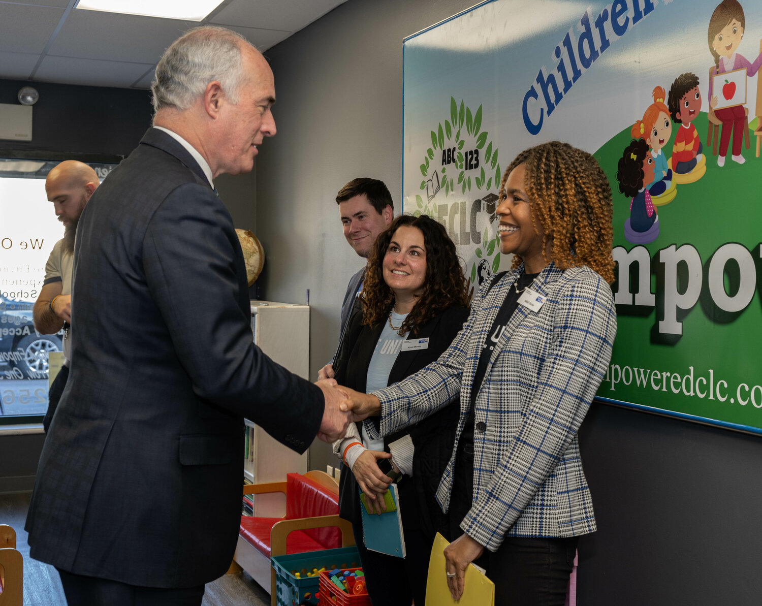 Senator Bob Casey greets Nikki Farrior, of United Way of Bucks County.