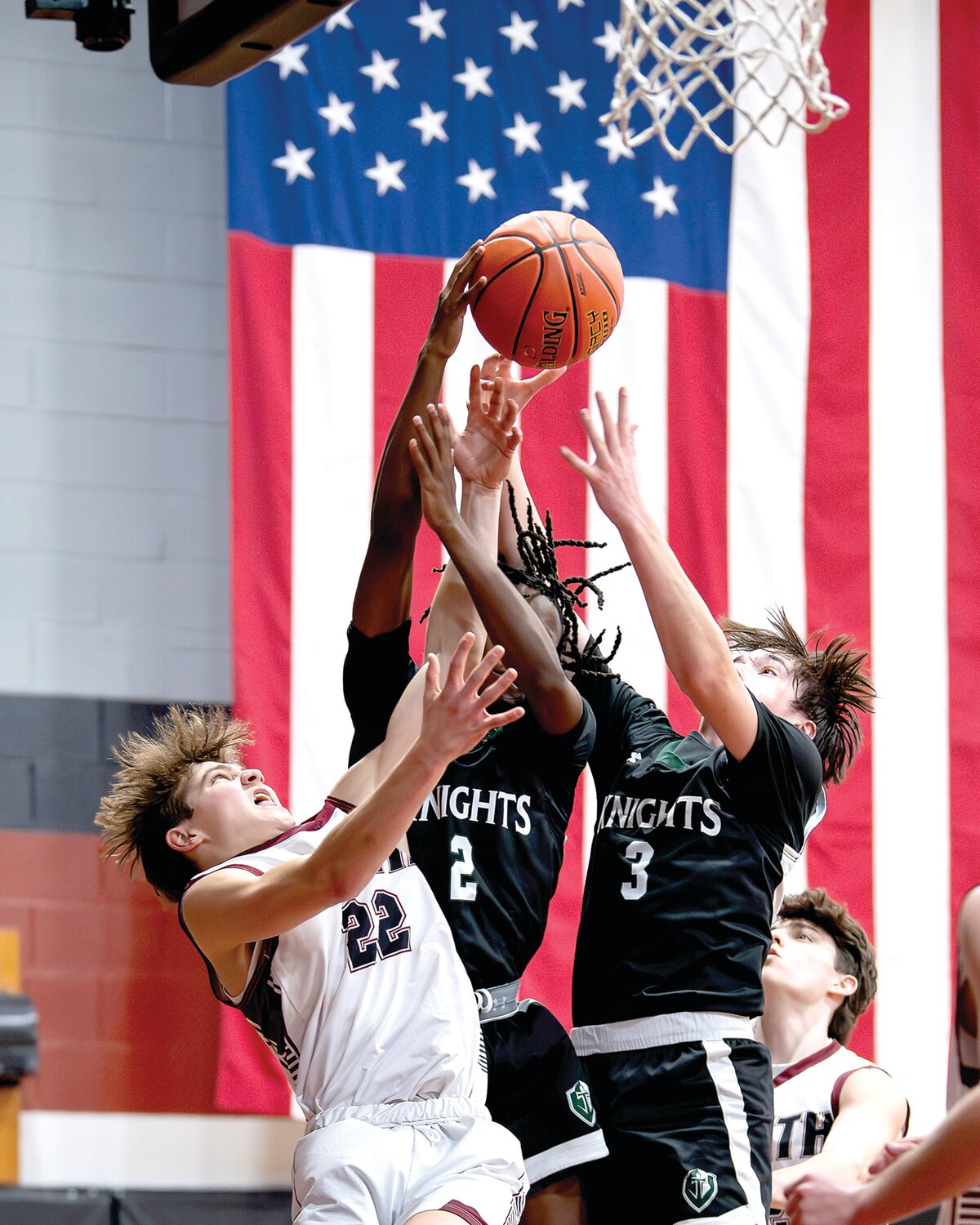 Faith Christian’s Jagger Verbit battles Delco Christian’s Atler Abobi and Beau Lyren for a rebound in the first half of Tuesday’s District One Class 2A semifinal game.