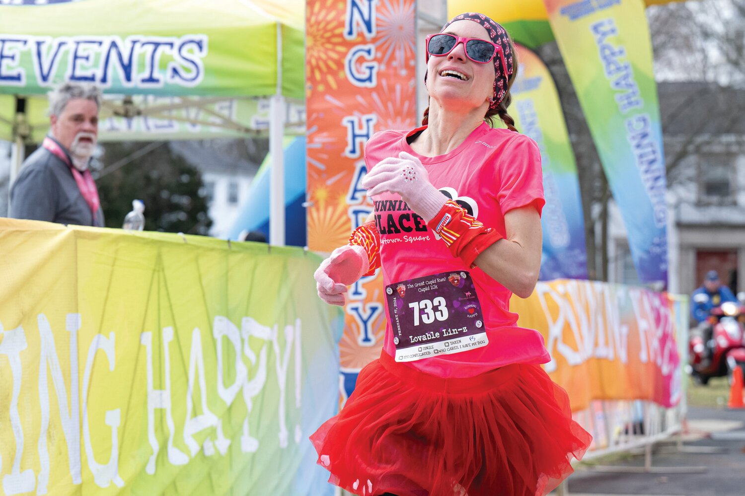 Lindsay Krakower, of Media, sprints across the finish line to win the Cupid 10K at Delaware Valley University.