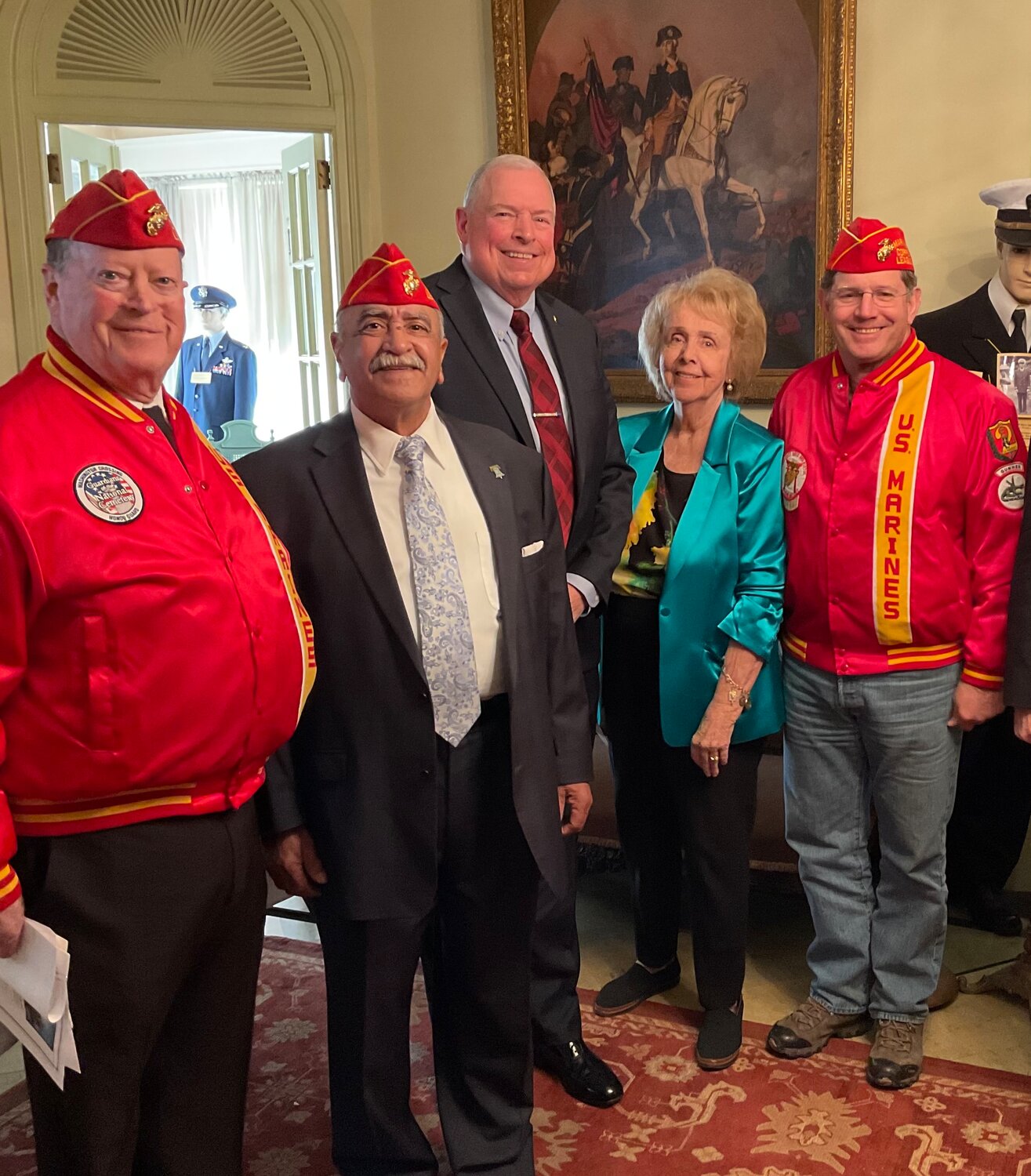 Marine Corps veterans, from left, John Heenan, of Ivyland; Gus Cales, of Langhorne; Michael Clark, of Warminster; and Don Barder, of Wycombe, talk with Kate Tweedy, of Buckingham, a volunteer foundation trustee at Shadyside on the Delaware.