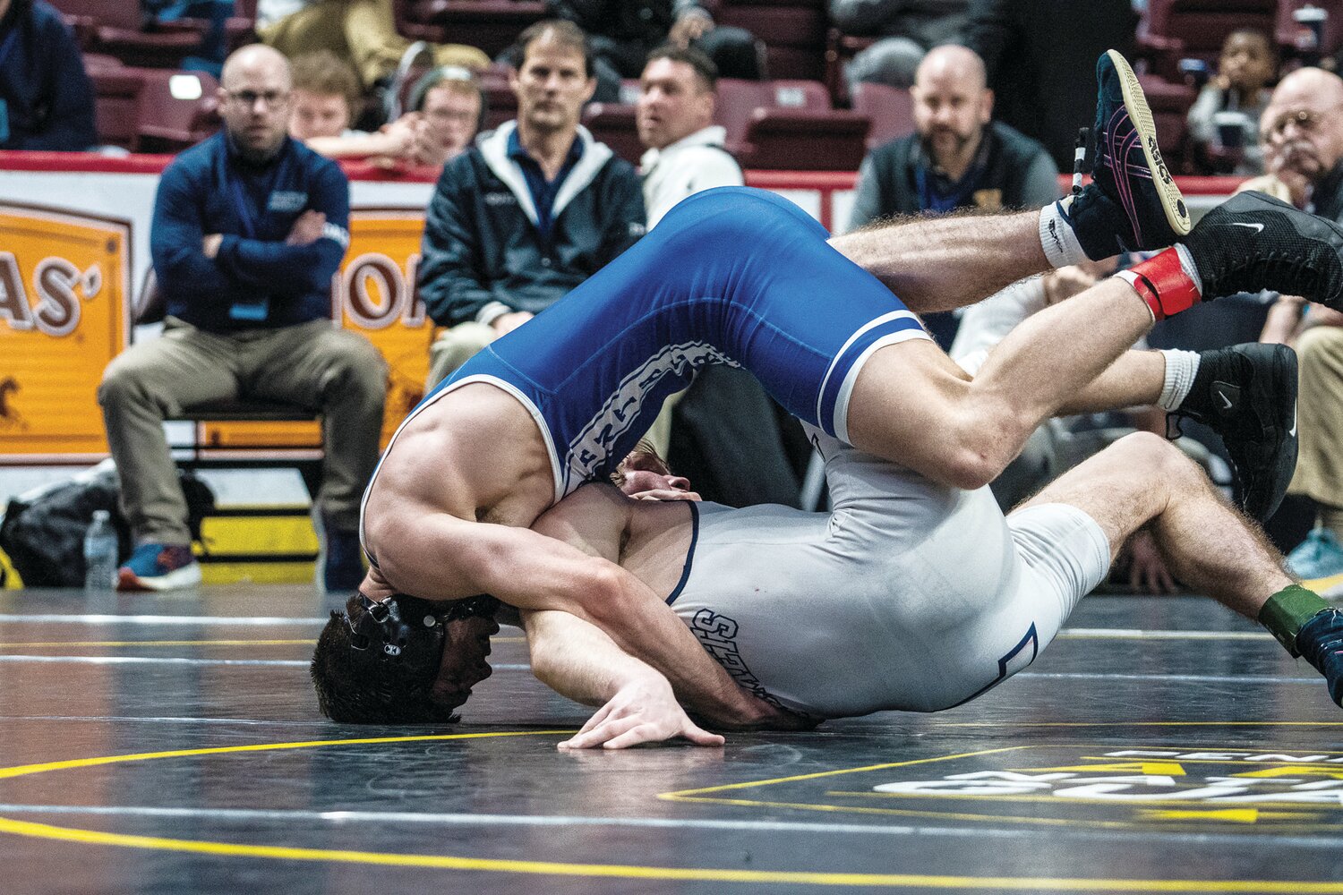 Quakertown’s Collin Gaj, in blue, won silver in the 152-pound class of the PIAA 3A tournament.