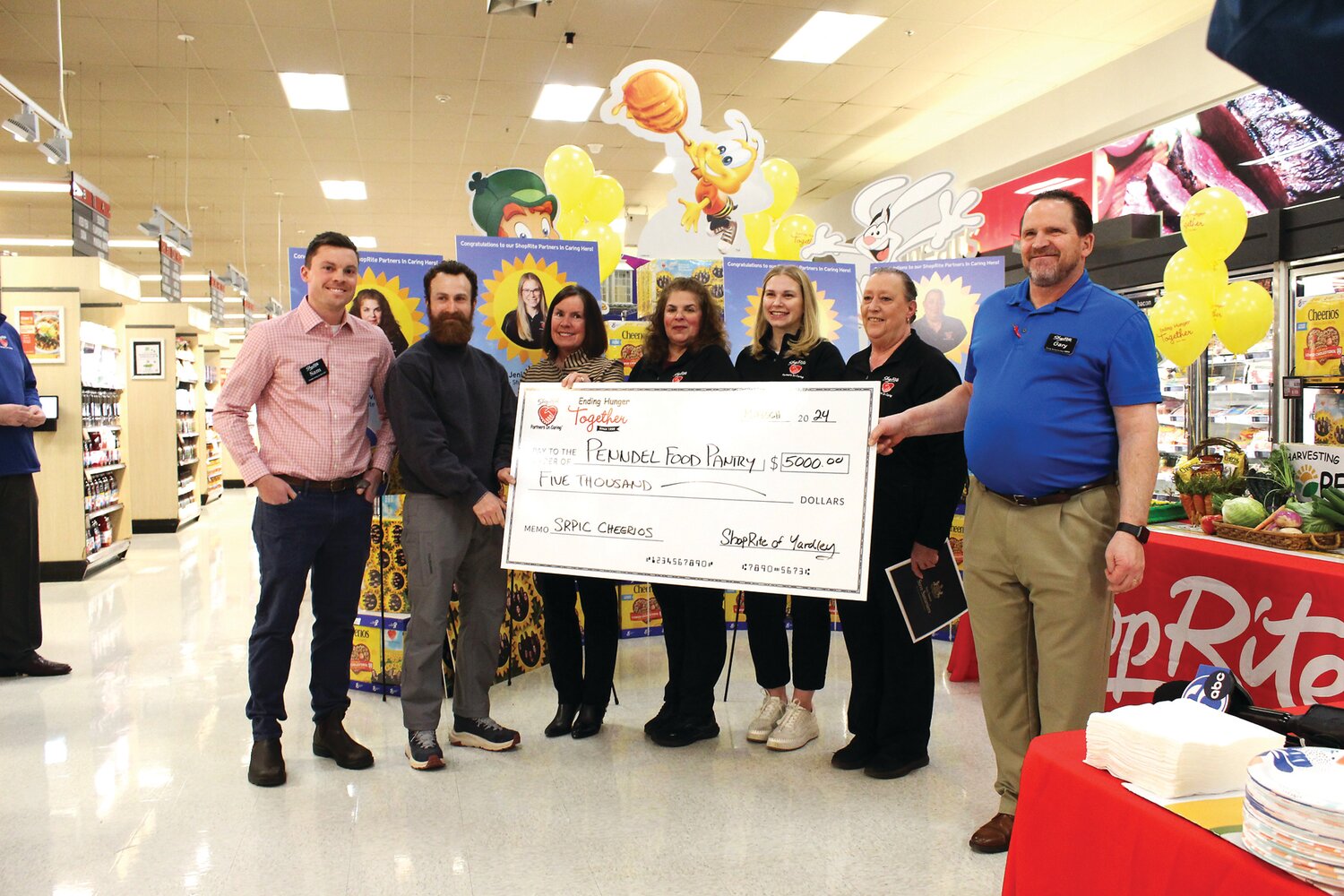 From left, at the check presentation, are: Sam Colalillo, ShopRite of Hunterdon County; Steven Keller, food pantry manager, Penndel Food Pantry; Jeannie Colalillo, director of community relations, ShopRite of Hunterdon County; Susan Pivarnik Roba, ShopRite of Yardley associate; Jenie Mussallem, ShopRite of Yardley associate; Dawn Pope, ShopRite of Yardley associate; and Gary Casterline, store manager, ShopRite of Yardley.