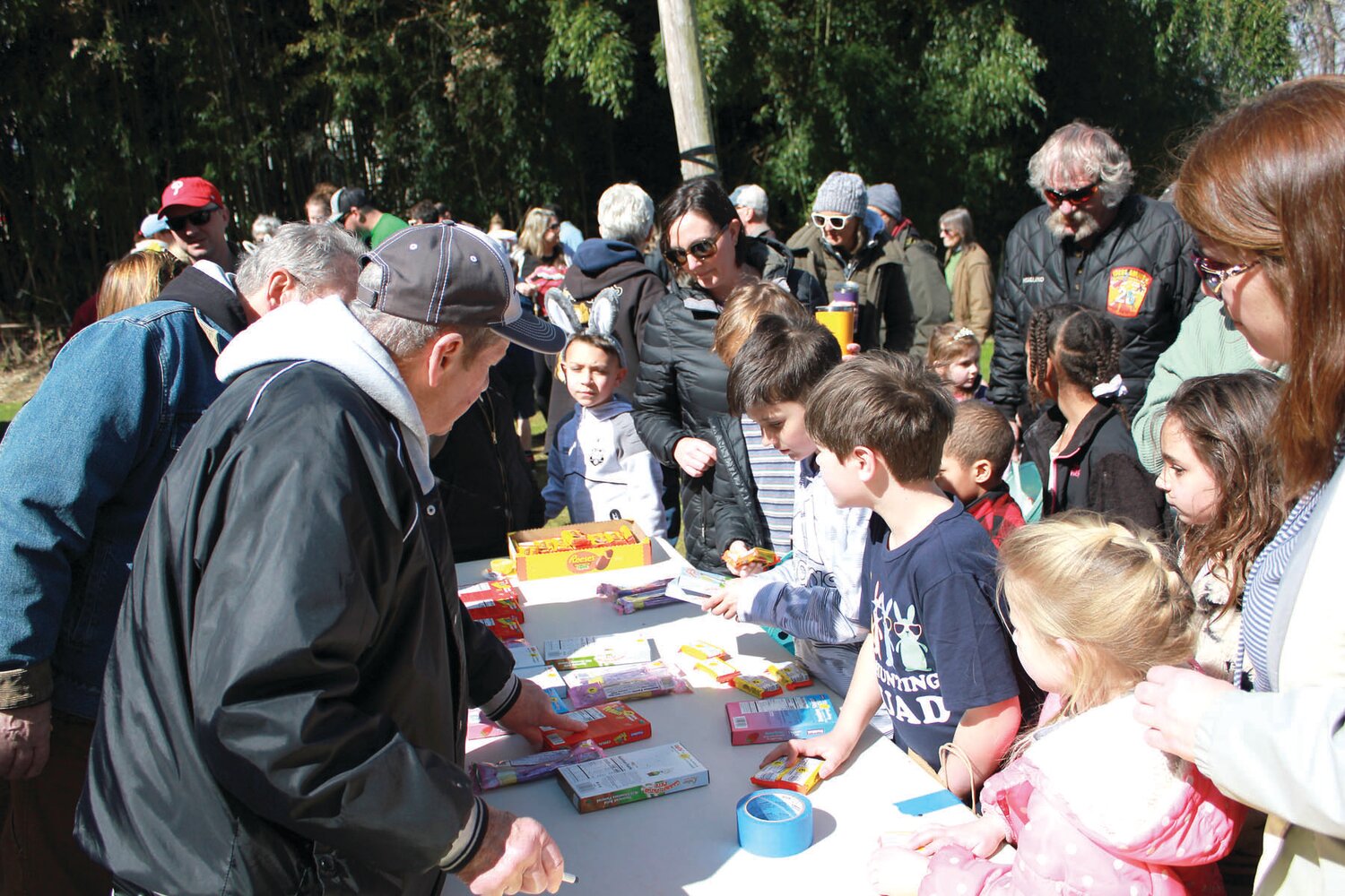 Kids eye items on the treat table.