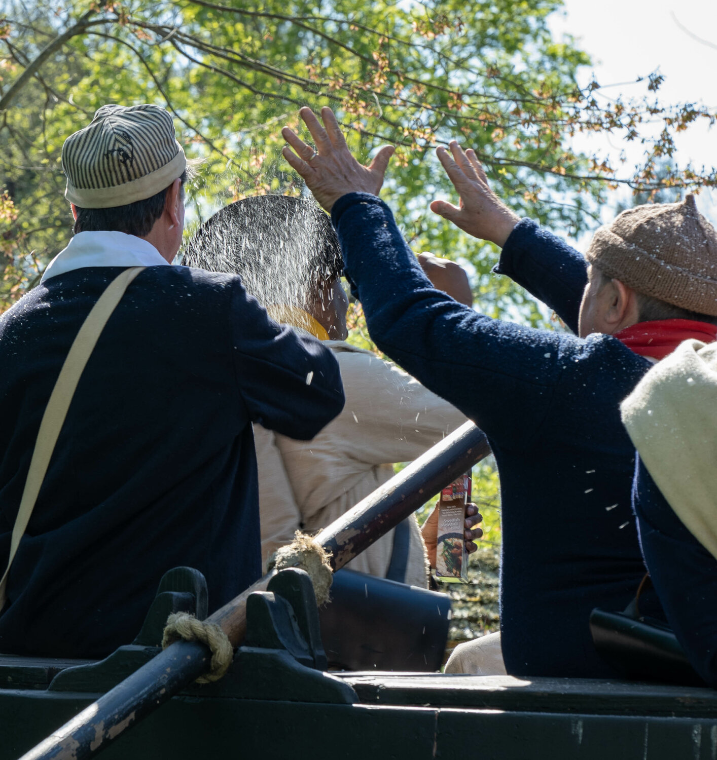 Reenactors sprinkle “snow” — actually instant mashed potato mix — on each other between takes.