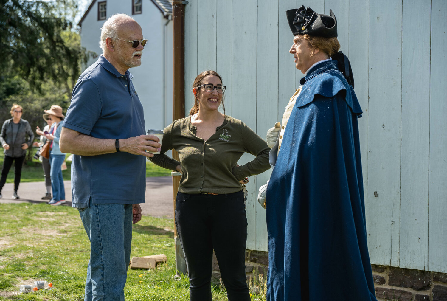 Jennifer Martin, executive director for the Friends of Washington Crossing Park, chats with executive producer Ralph Augstroze, left, and Daniel H.T. Shippey, who plays George Washington.