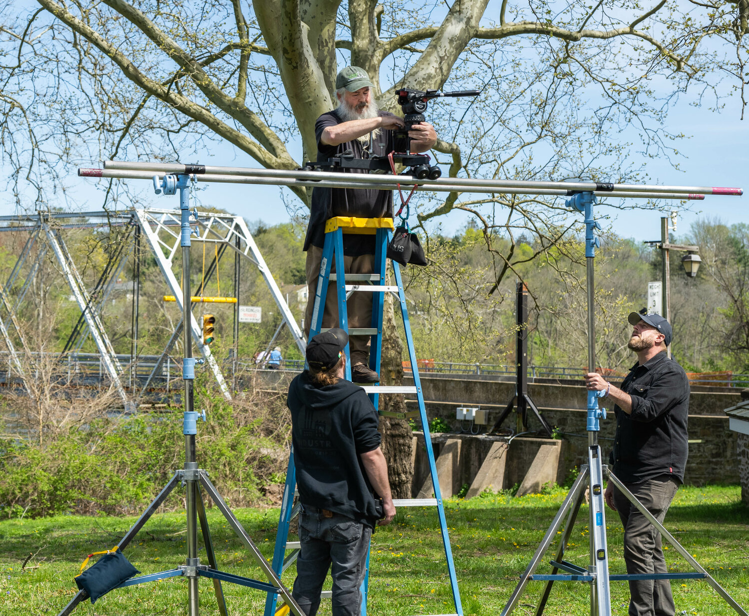 Director of Photography Stephen Lyons positions a camera in an elevated location during shooting Tuesday.