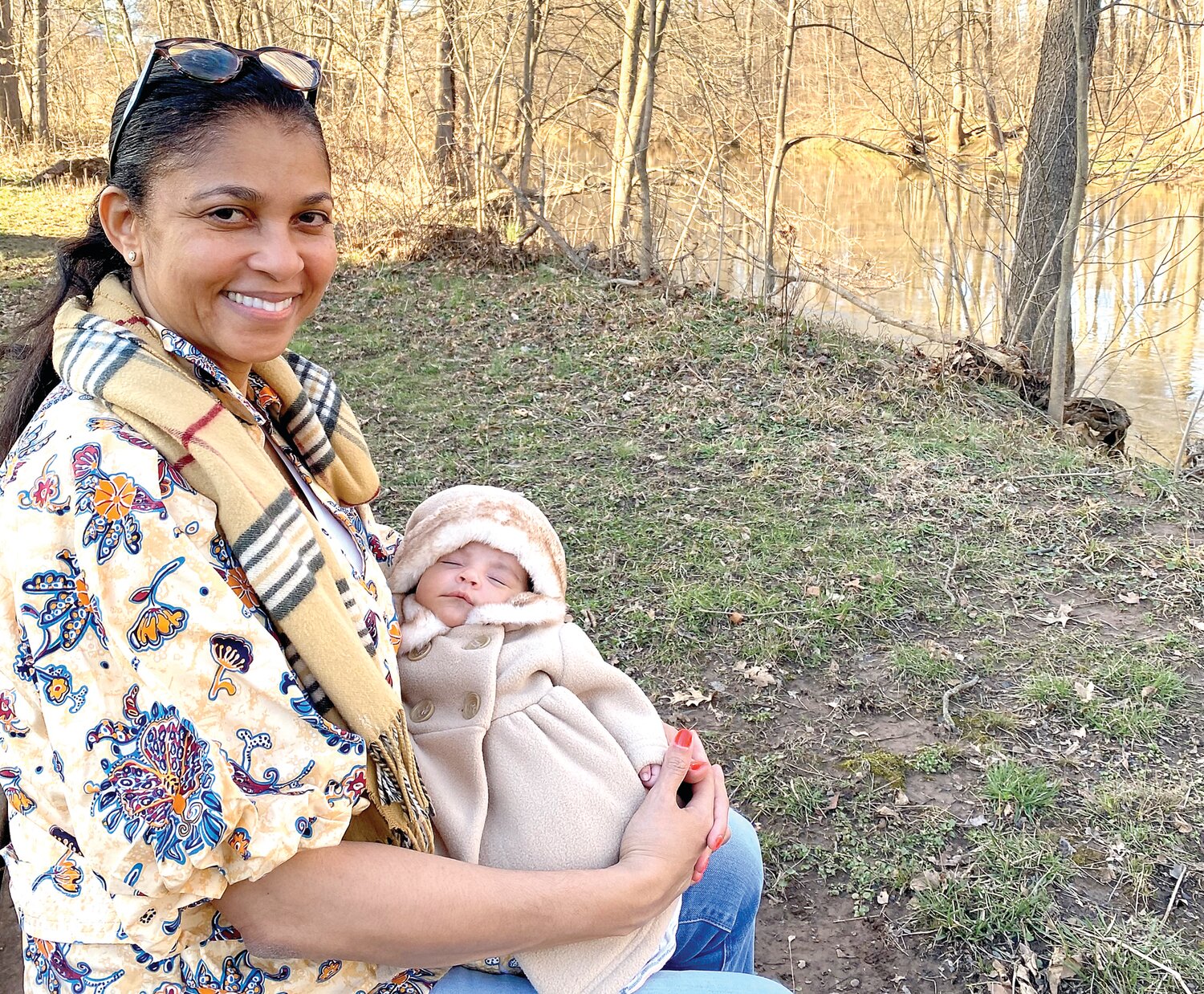 Little Sarah-Ann Victoria Tonra sleeps in the arms of mother Antonett Kerr Tonra, of Doylestown, who became a mom this year for the first time at age 54.