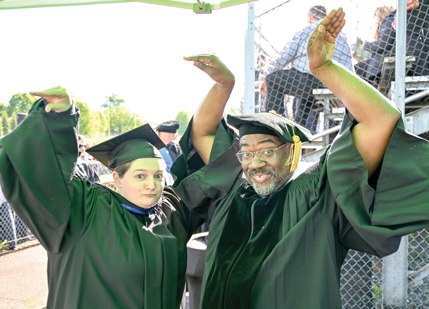 English professor Dr. Wilbert Turner Jr. and Access Service librarian Claire Drolet enjoy the celebration Saturday morning during Delaware Valley University’s commencement ceremony.