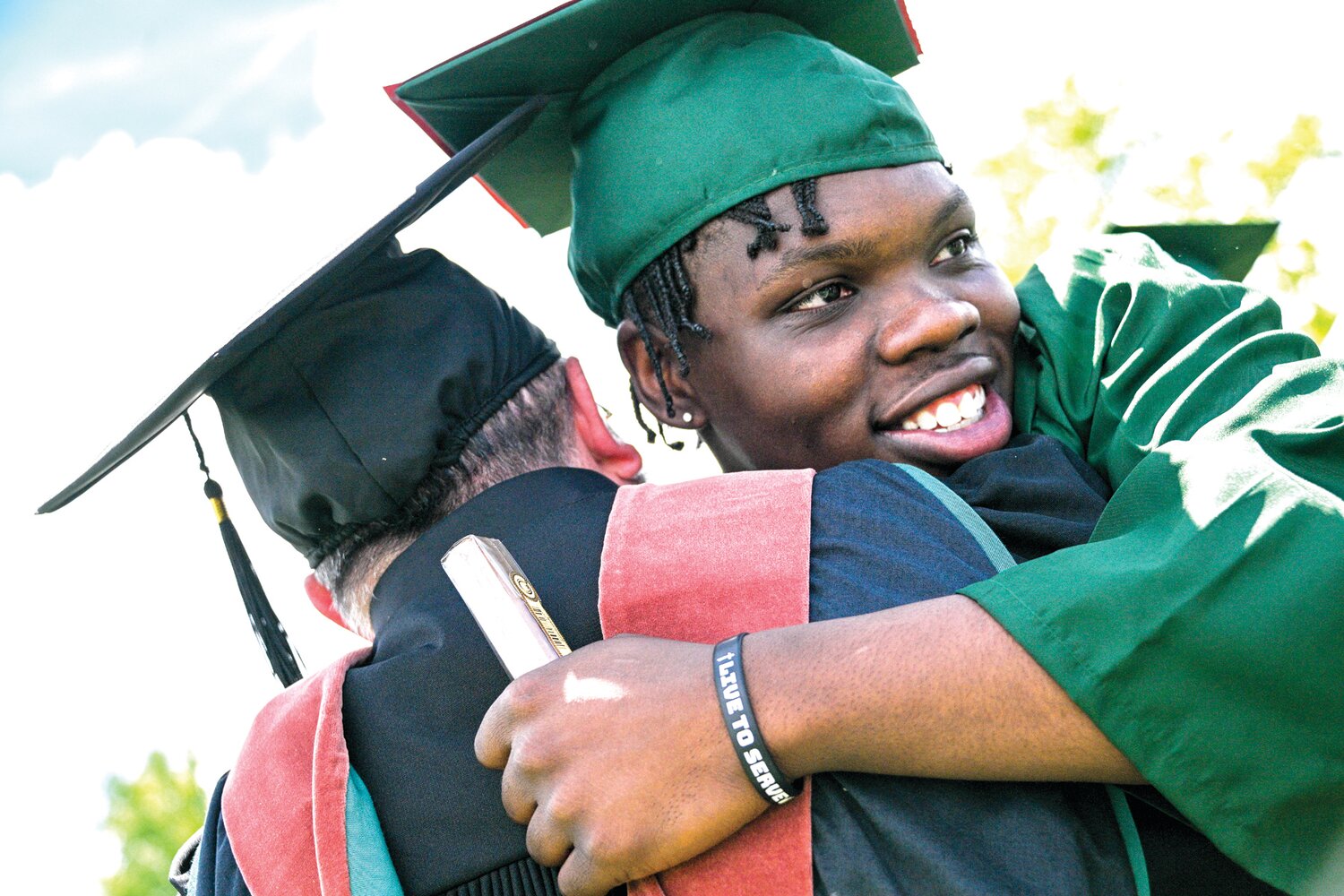 Student Joshua Pierre embraces professor Doug McCambridge following Delaware Valley University’s commencement ceremony for the Class of 2024.