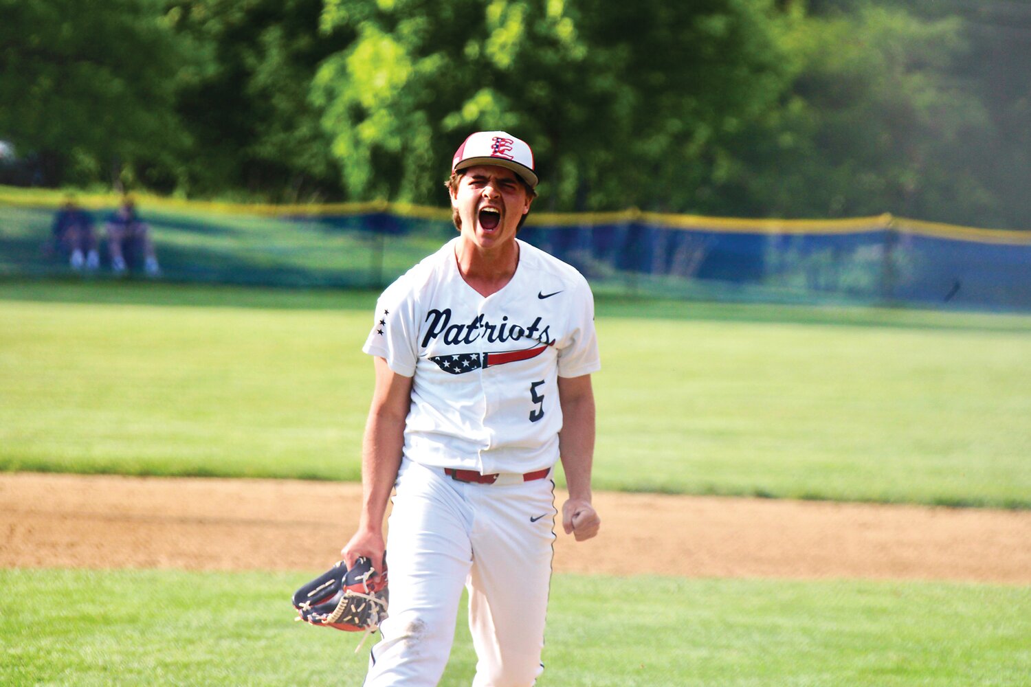 Central Bucks East relief pitcher Sam Bliss celebrates after getting out of a jam.