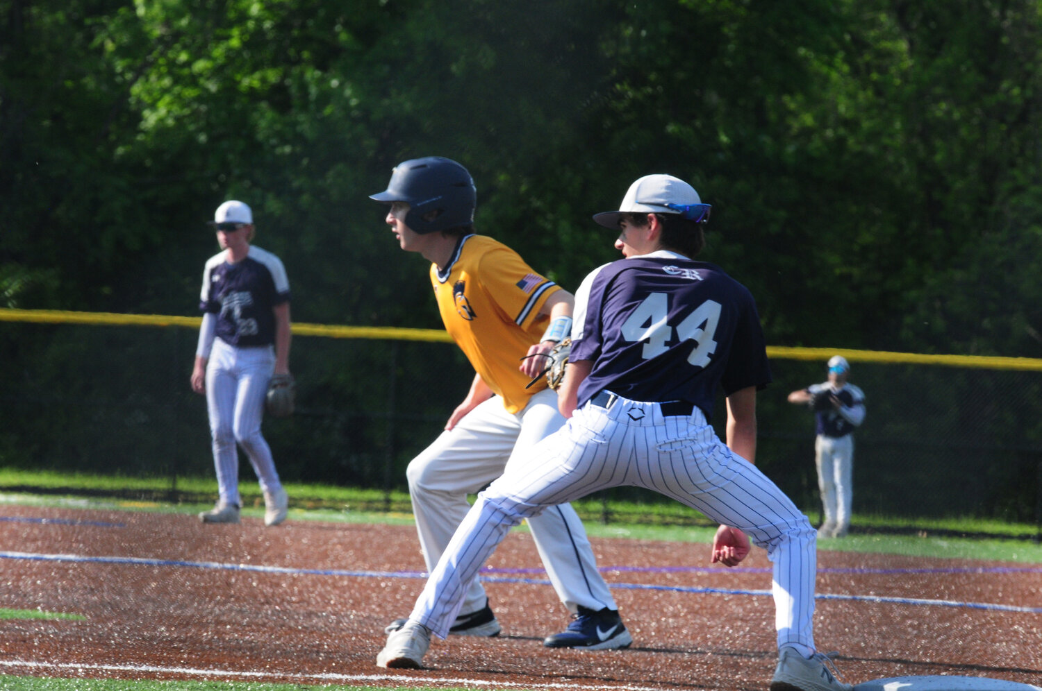 Council Rock North infielder Joe Rizzo, right, keeps the baserunner close in Monday’s District One playoff opening loss to Wissahickon.