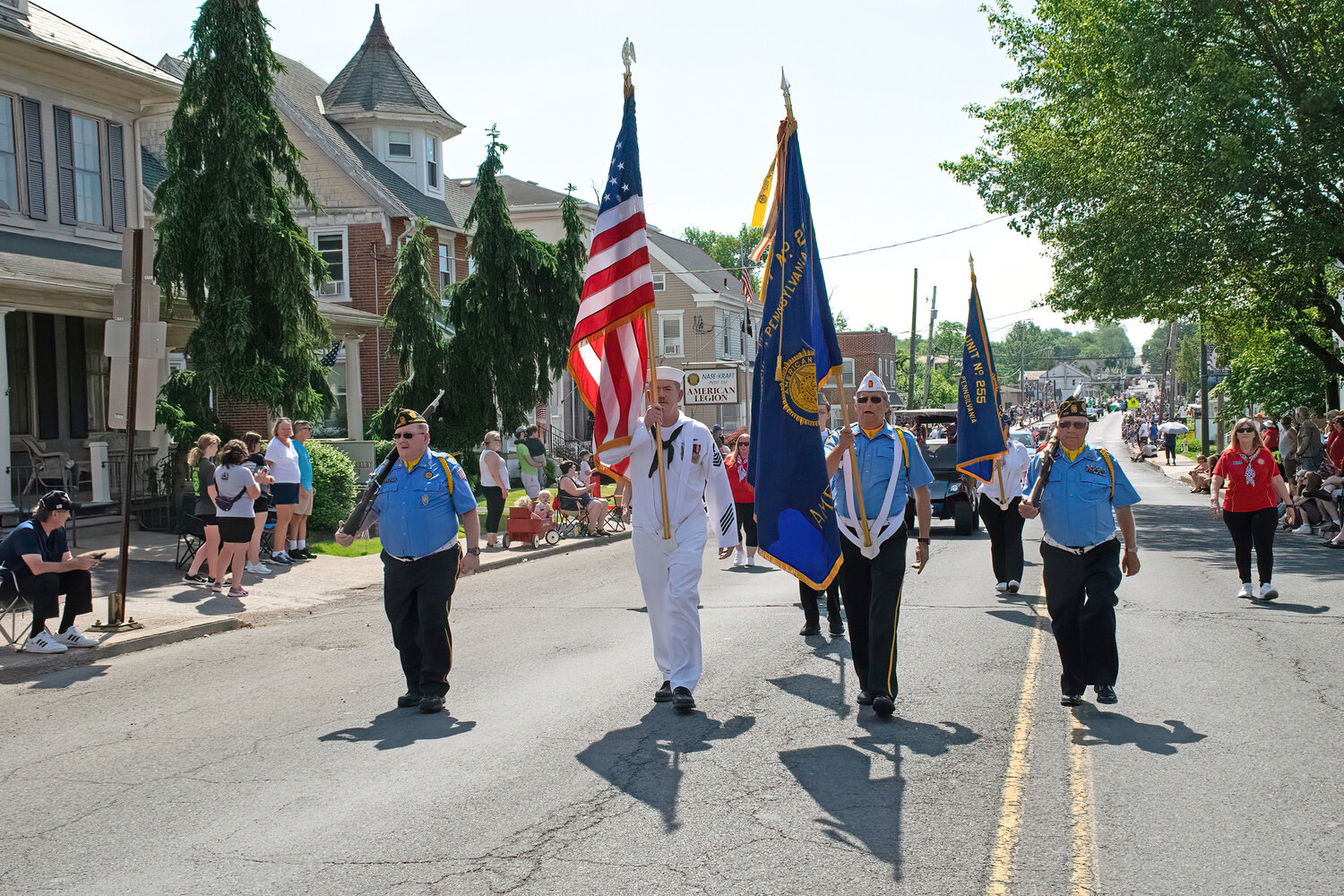 The parade begins with a march down Main Street.