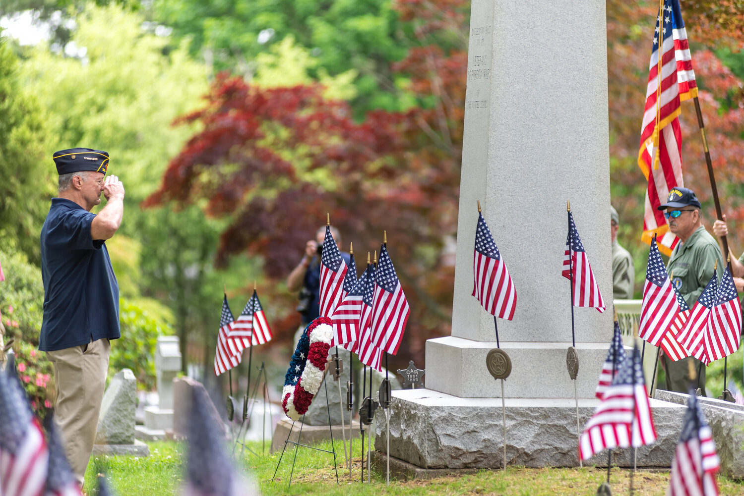 American Legion Post 210 Commander Pete Scott salutes during Monday’s wreath-laying ceremony at Doylestown Cemetery.