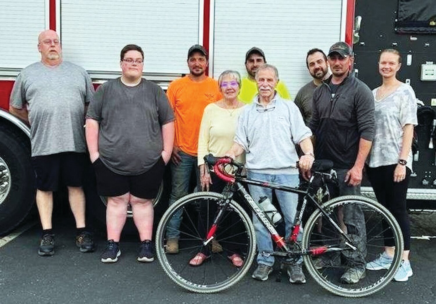 Dr. Jay Leeb stands with his bike and Point Pleasant Fire Co. first responders who helped save his life after he had a cardiac event while riding his bicycle last month.