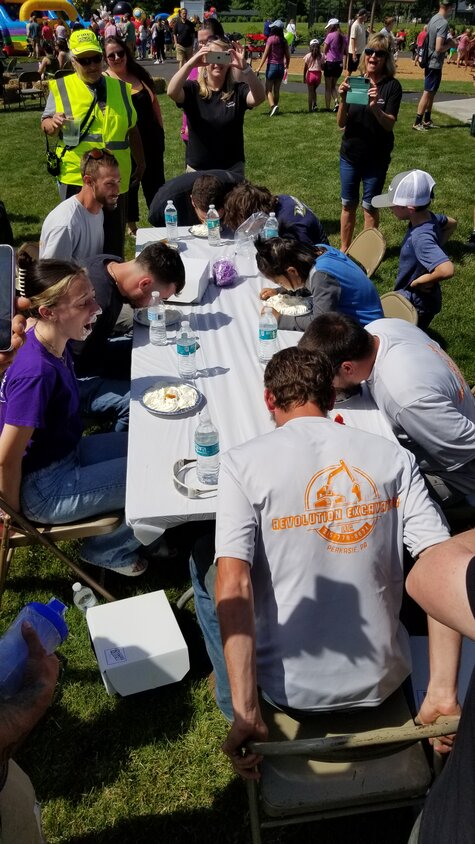 Pie-eating contest participants battle it out.