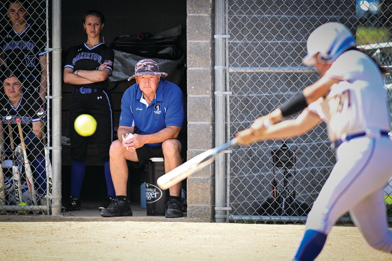 Quakertown manager Rich Scott watches a sacrifice fly by Downingtown West’s Ava Kaczmarski, making the score 2-0 in the bottom of the first inning of last Thursday’s District One 6A final.