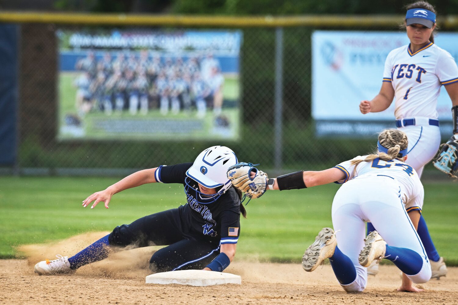 Downingtown West’s Emma Ahlborn tags Quakertown’s Ava Beal while trying to steal second base in the fifth inning.