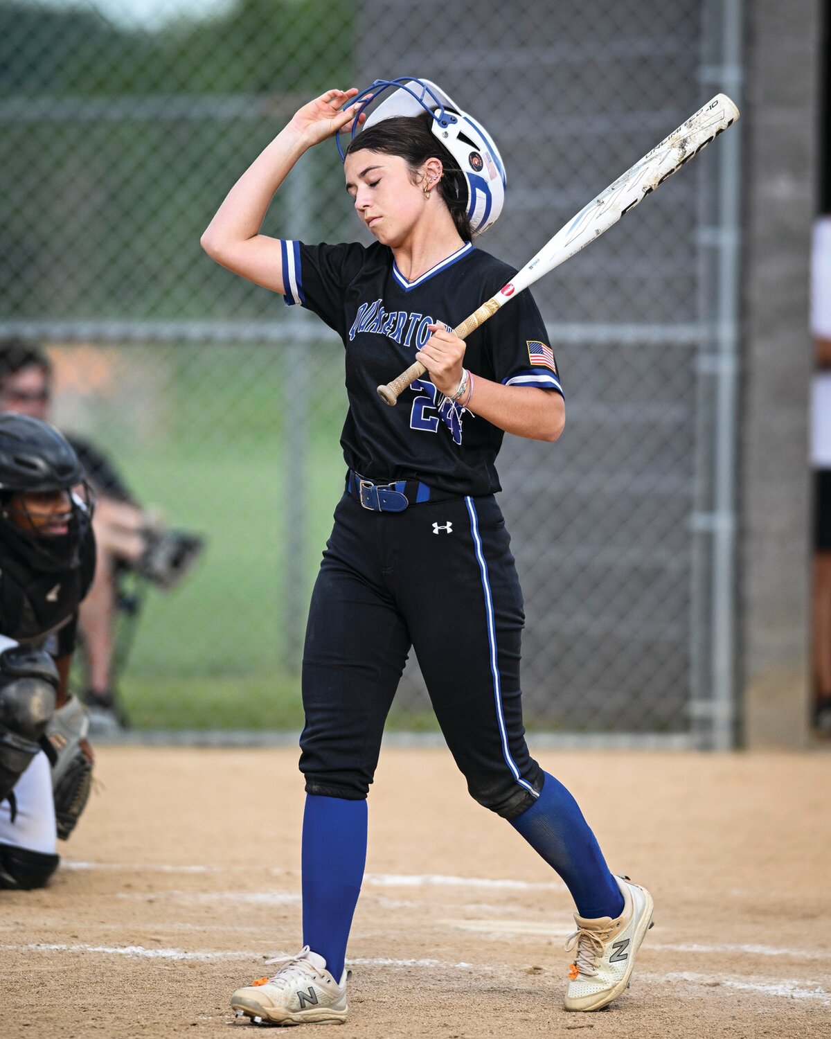 Quakertown’s Ava Beal shows her frustration after striking out in the top of the seventh inning of Thursday’s district final.