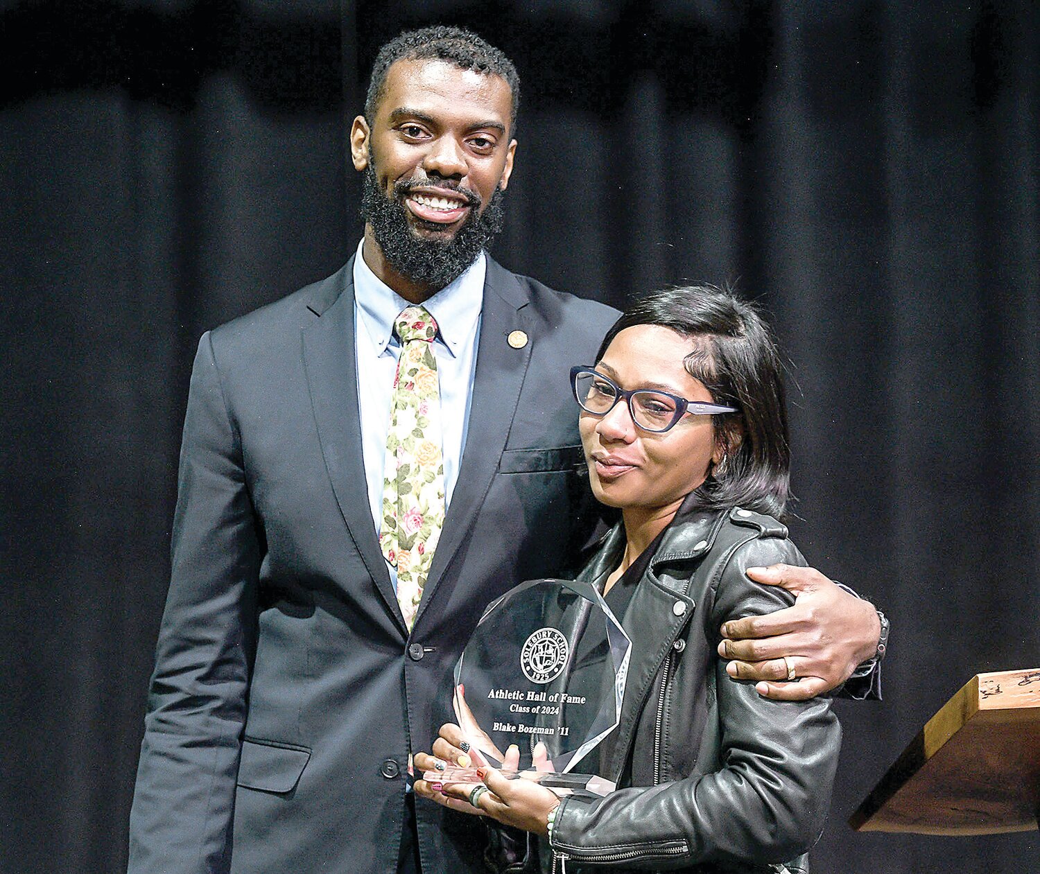 Blake Bozeman, Class of 2011, was posthumously inducted into the Solebury School  Athletic Hall of Fame. Tiera Bozeman accepted the award for her late husband. Standing with her is Blake Bozeman’s fellow classmate Phil Walker.