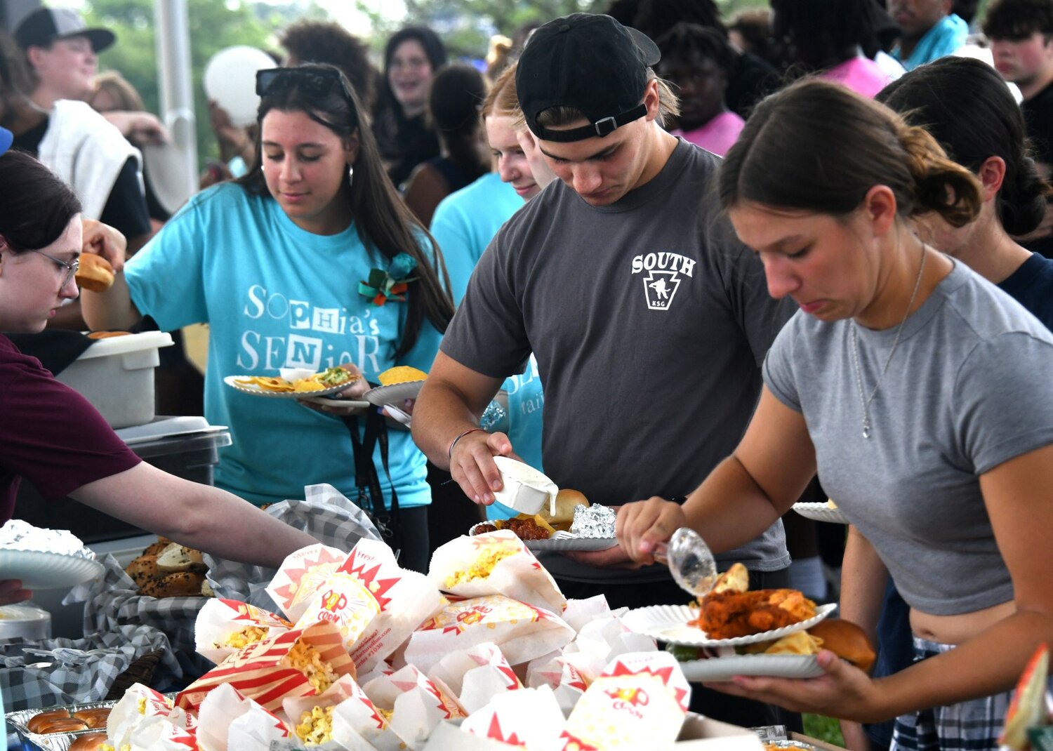 Bensalem seniors enjoy food donated by the sponsors of Sophia’s Senior Tailgate at the high school on Wednesday.