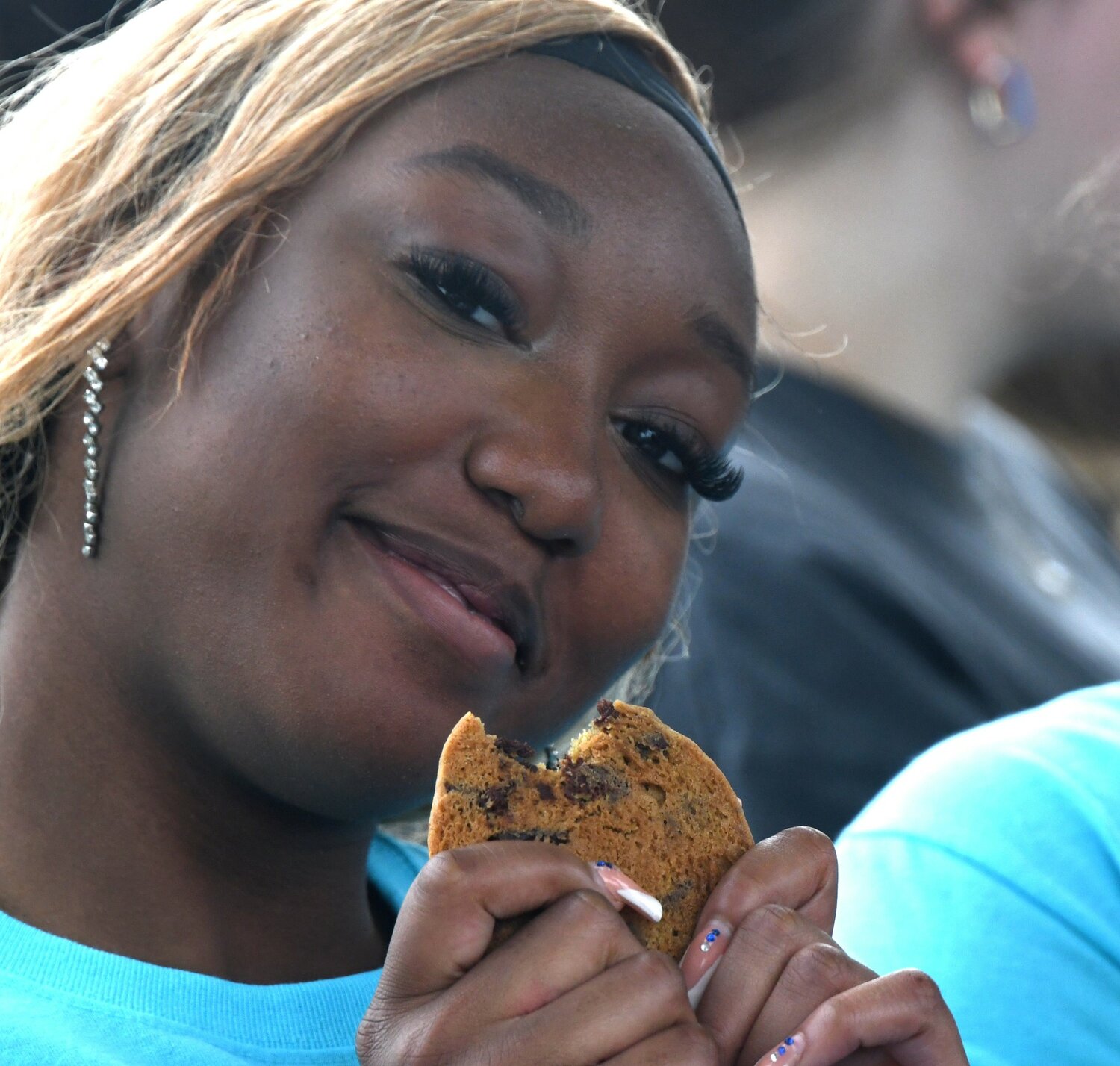 Ashley Tarr, a Bensalem HS senior, enjoys a cookie at Sophia’s Senior Tailgate.