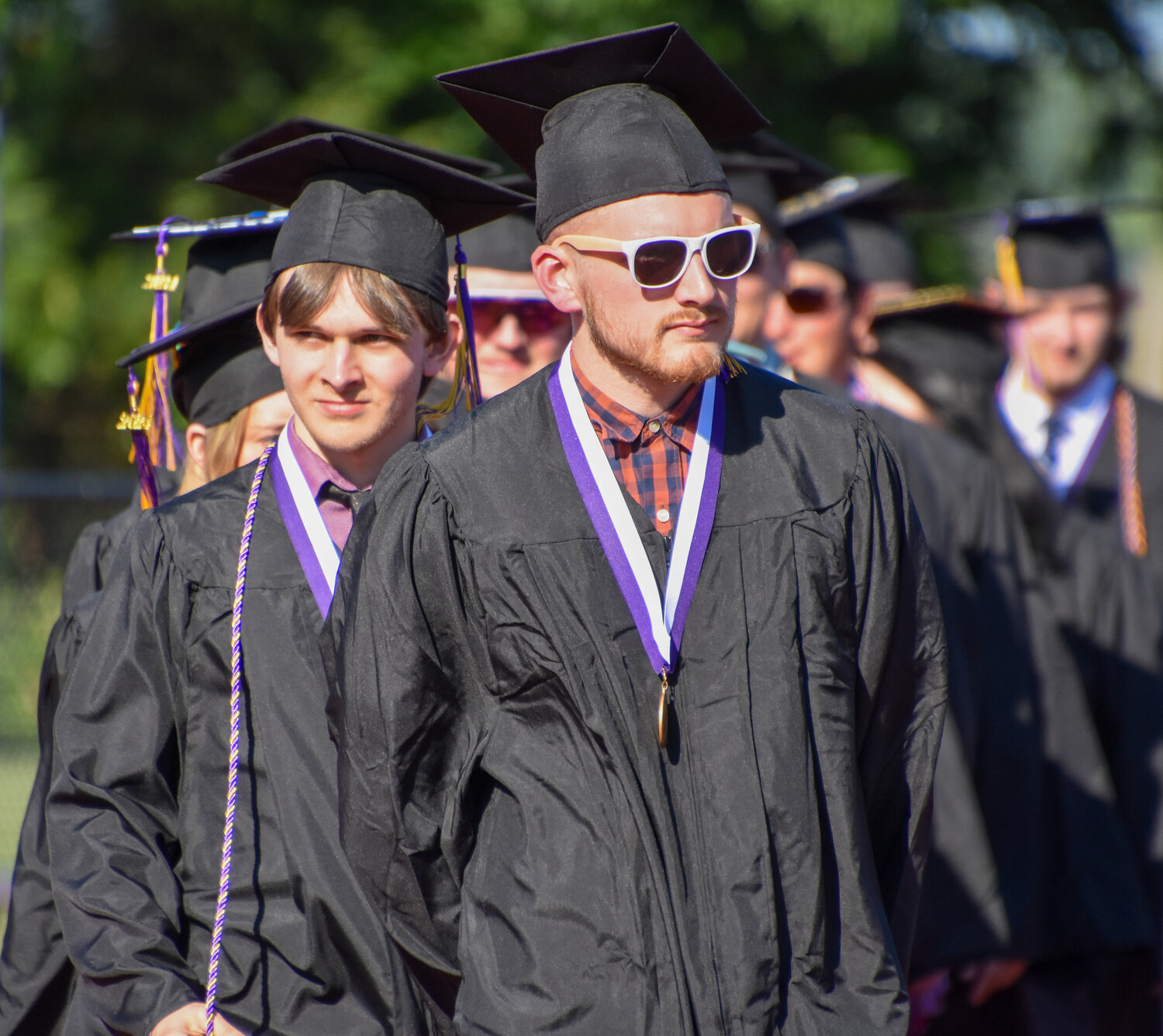 A procession of Palisades seniors begins the May 31 graduation ceremony.