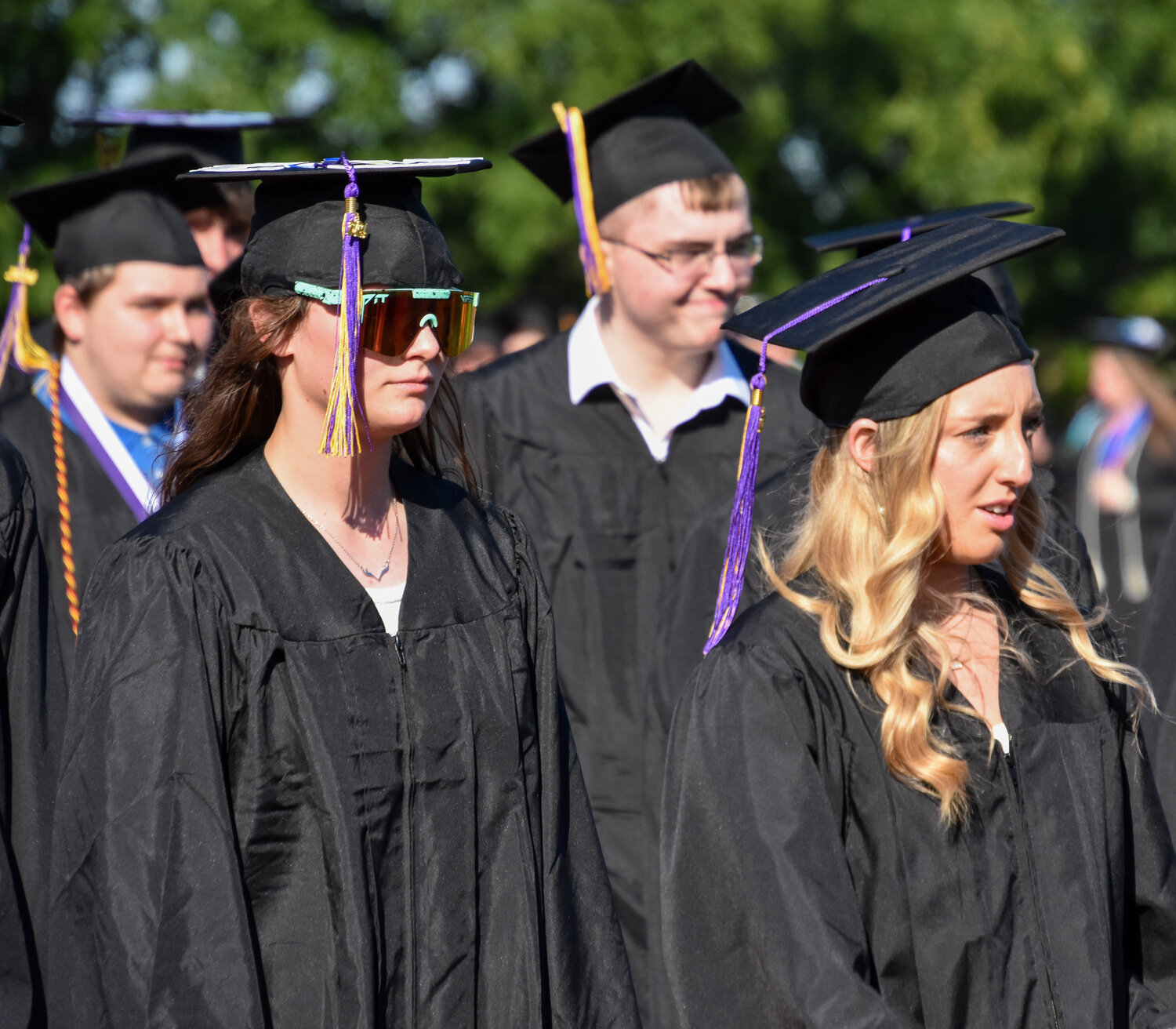 Students head for their seats at the start of the graduation ceremony.