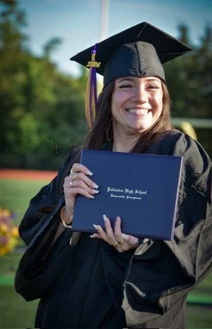 Ryan Walsh receives her diploma.