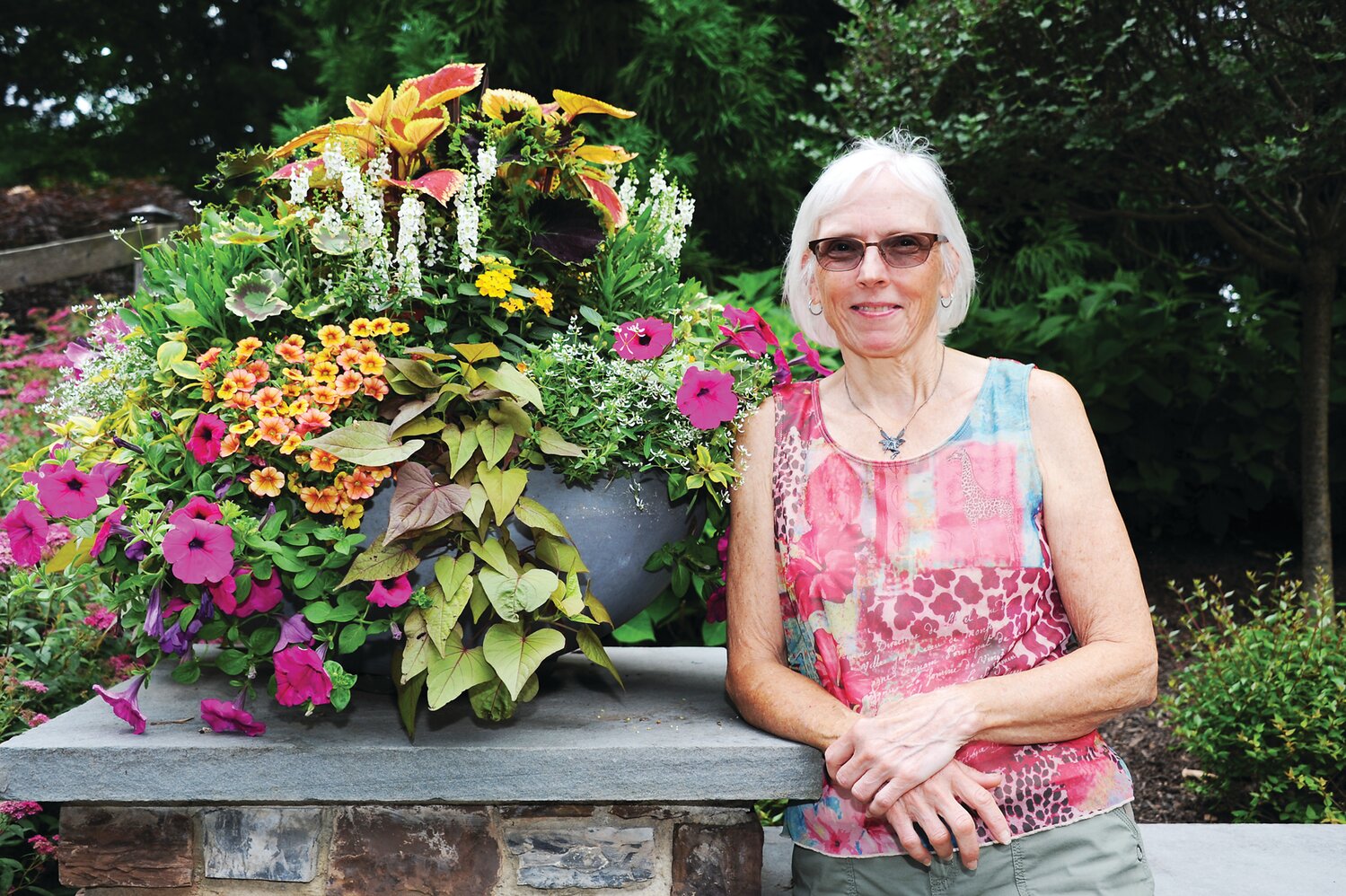 Kim Kurki does the daily gardening at the Barber residence.