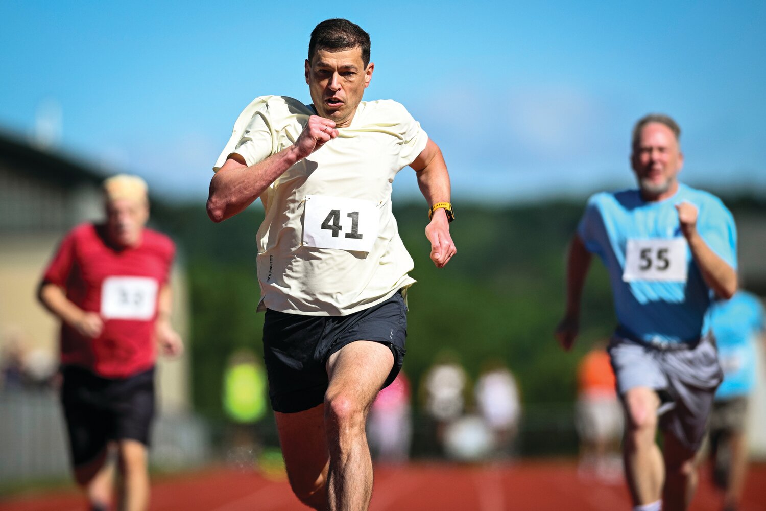 Vitaly Belotserkovsky finishes first in the second heat of the 100-meter dash.