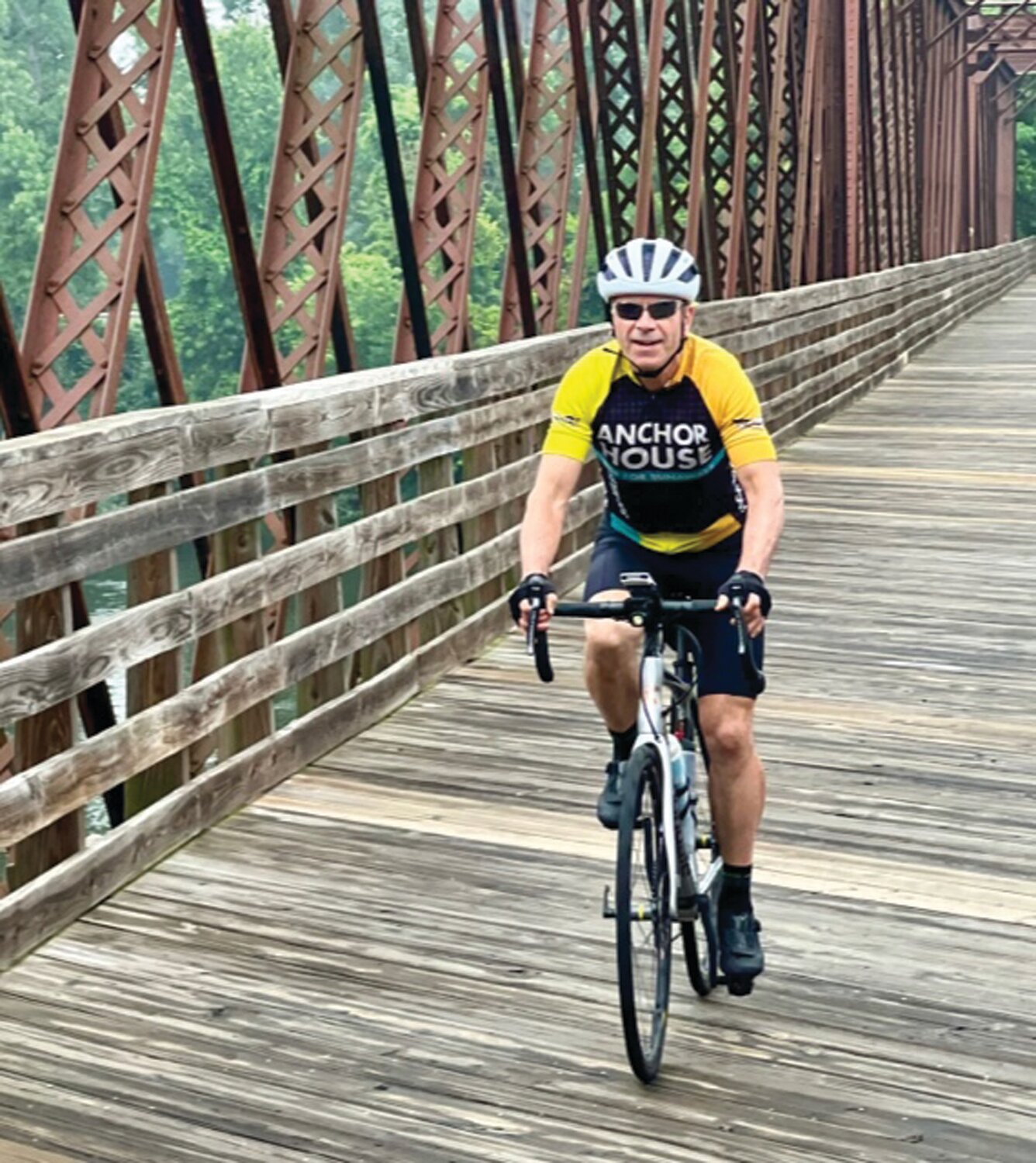 Joe Boyce traverses a wooden bridge in Northampton, Massachusetts in a previous year’s Ride for Runaways.