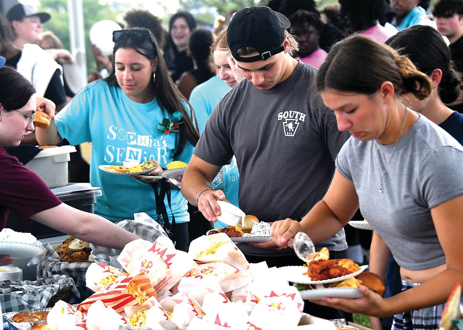 Bensalem seniors enjoy food donated by the sponsors of Sophia’s Senior Tailgate at the high school on Wednesday.